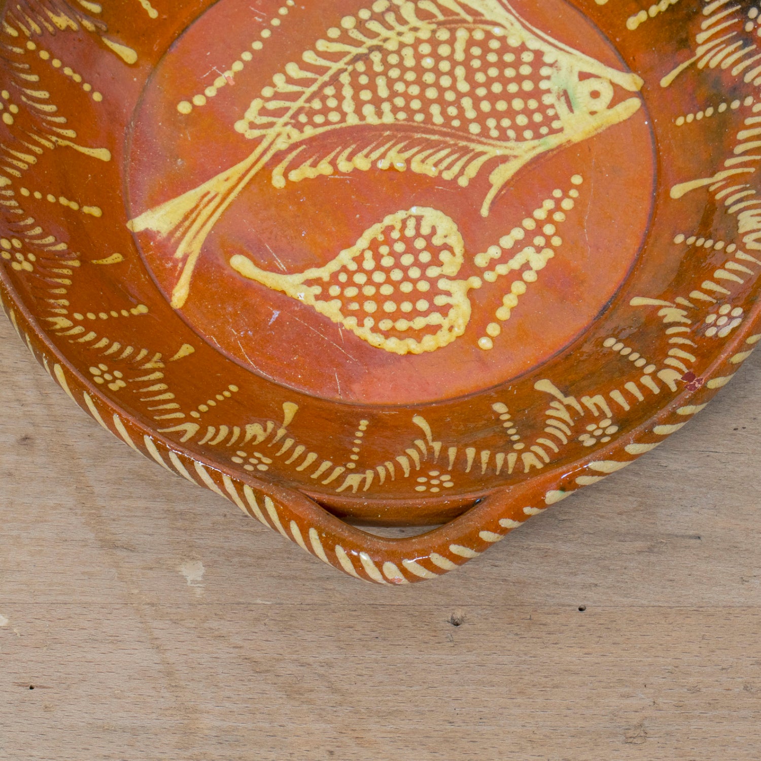 19th Century Portuguese Red Slipware Round Serving Dish with Fish and Leaf Motifs