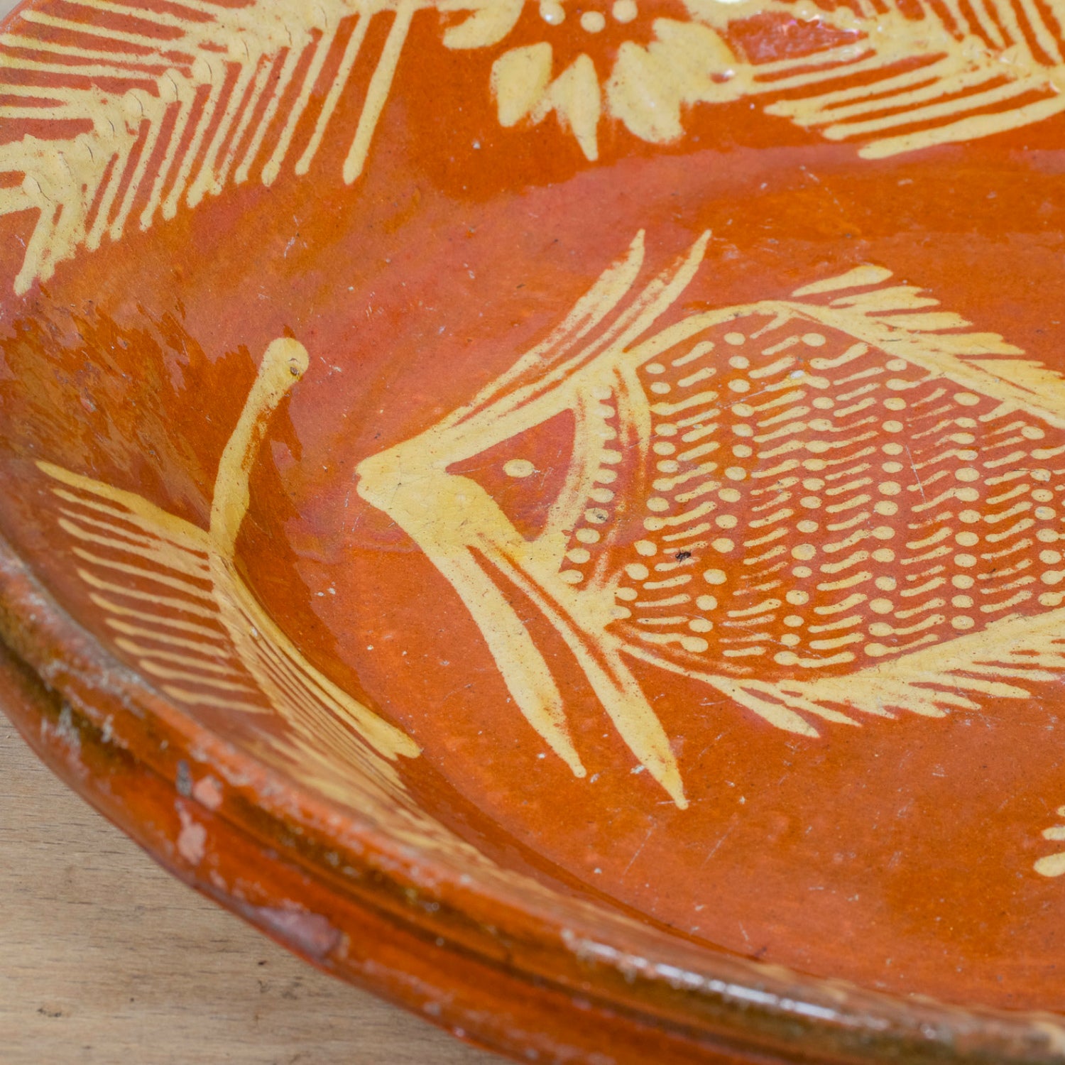 19th Century Portuguese Red Slipware Serving Bowl with Fish and Floral Motifs