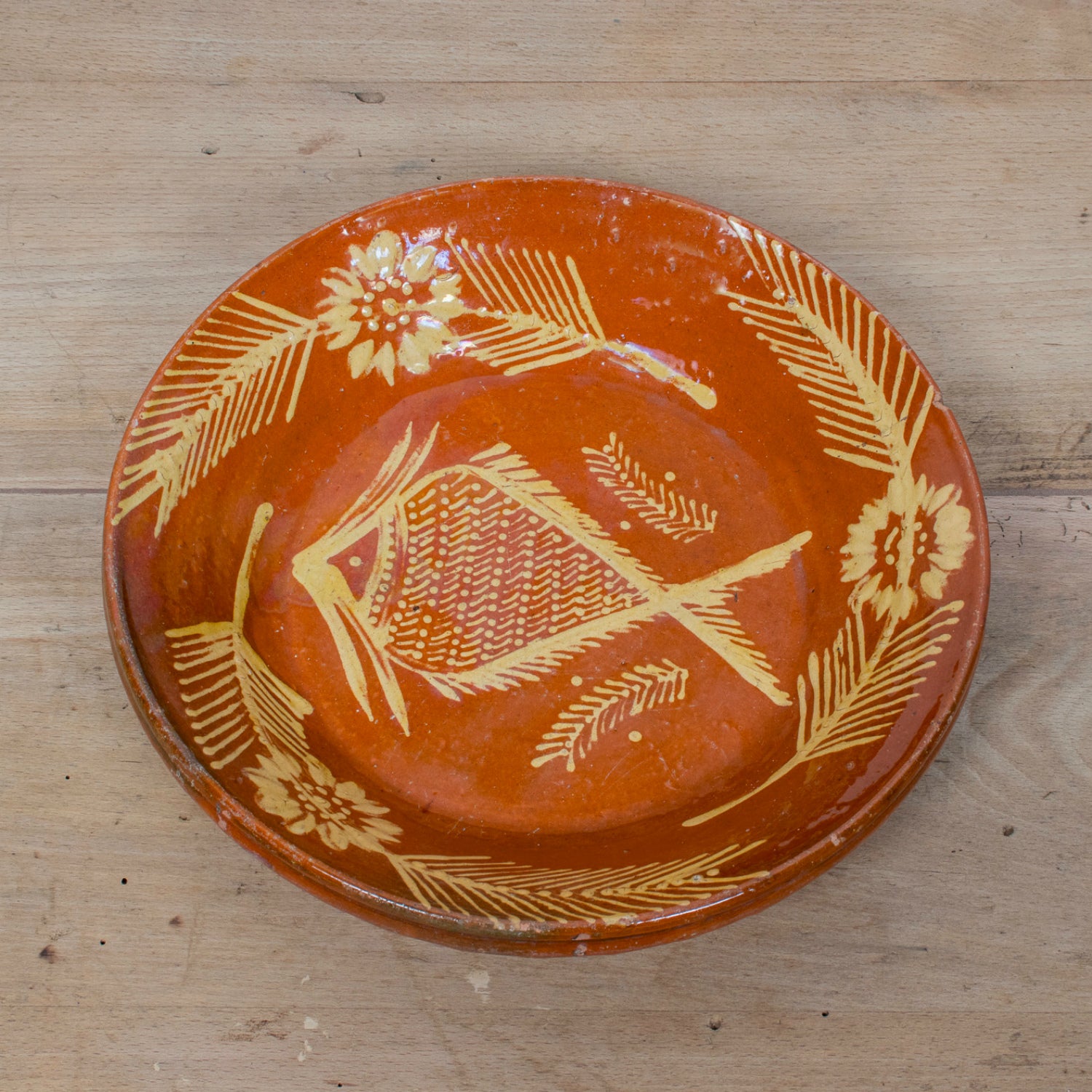 19th Century Portuguese Red Slipware Serving Bowl with Fish and Floral Motifs