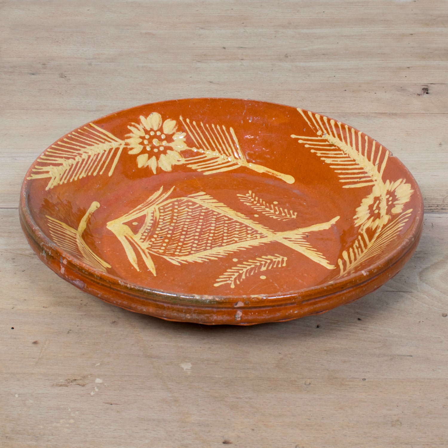 19th Century Portuguese Red Slipware Serving Bowl with Fish and Floral Motifs