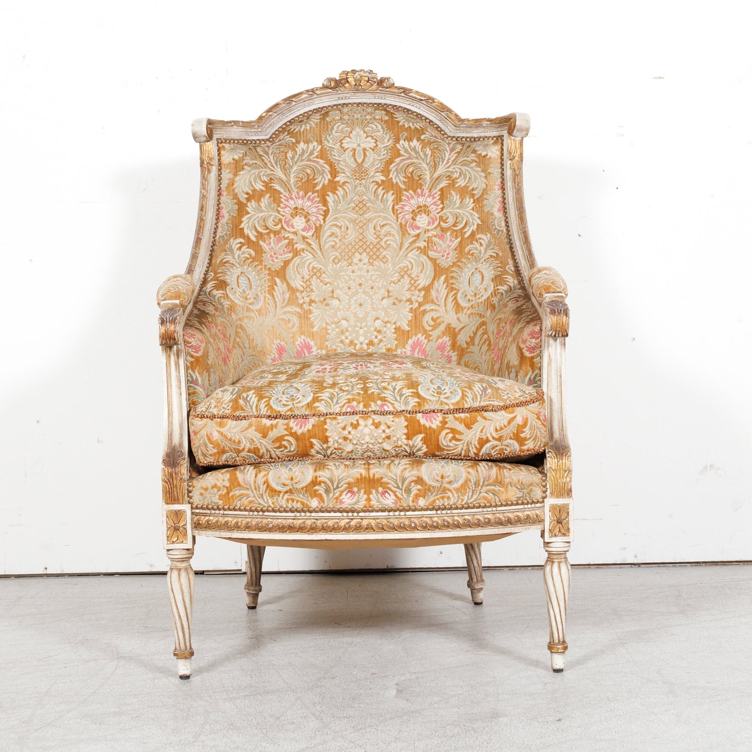 Pair of Early 21st Century French Louis XVI Style Parcel Gilt and Painted Maison Jansen Bergere Armchairs