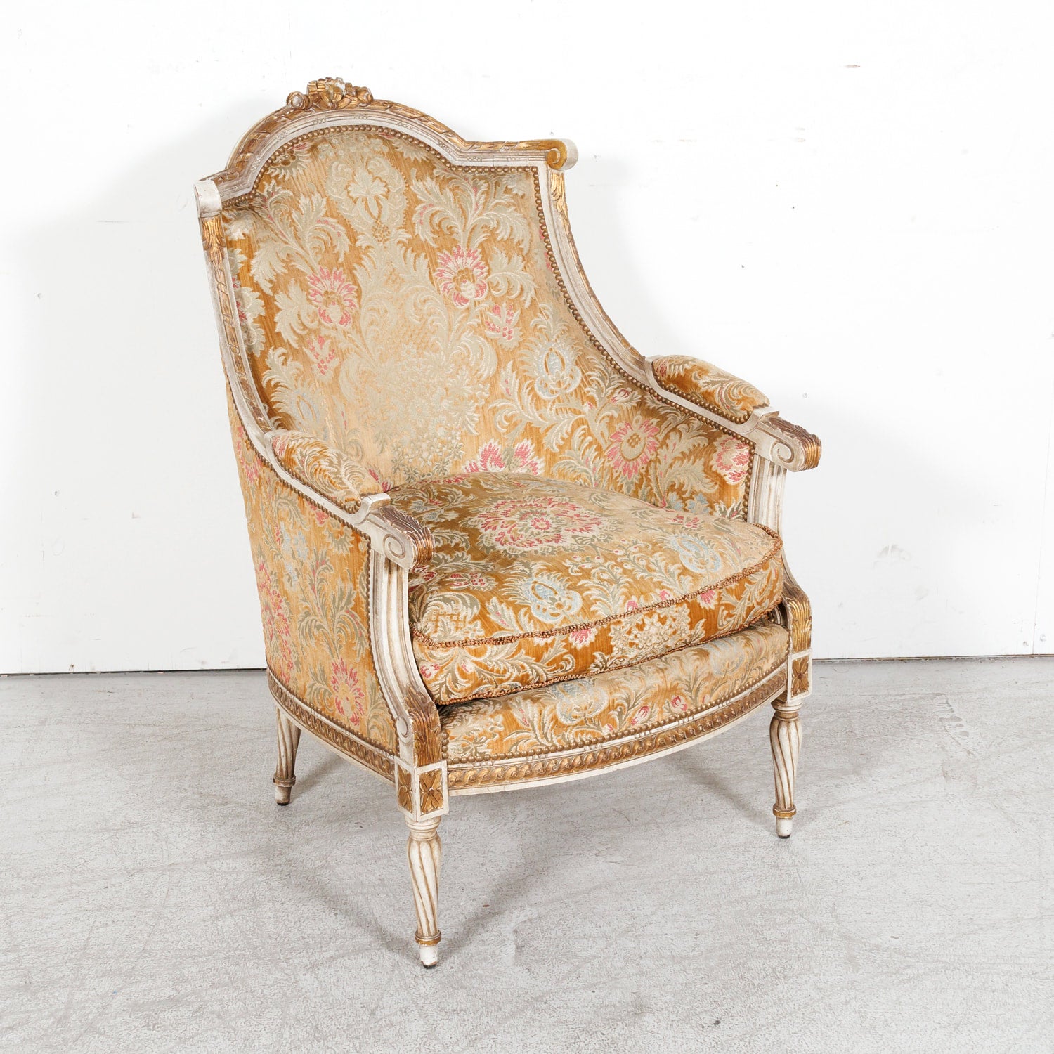 Pair of Early 21st Century French Louis XVI Style Parcel Gilt and Painted Maison Jansen Bergere Armchairs