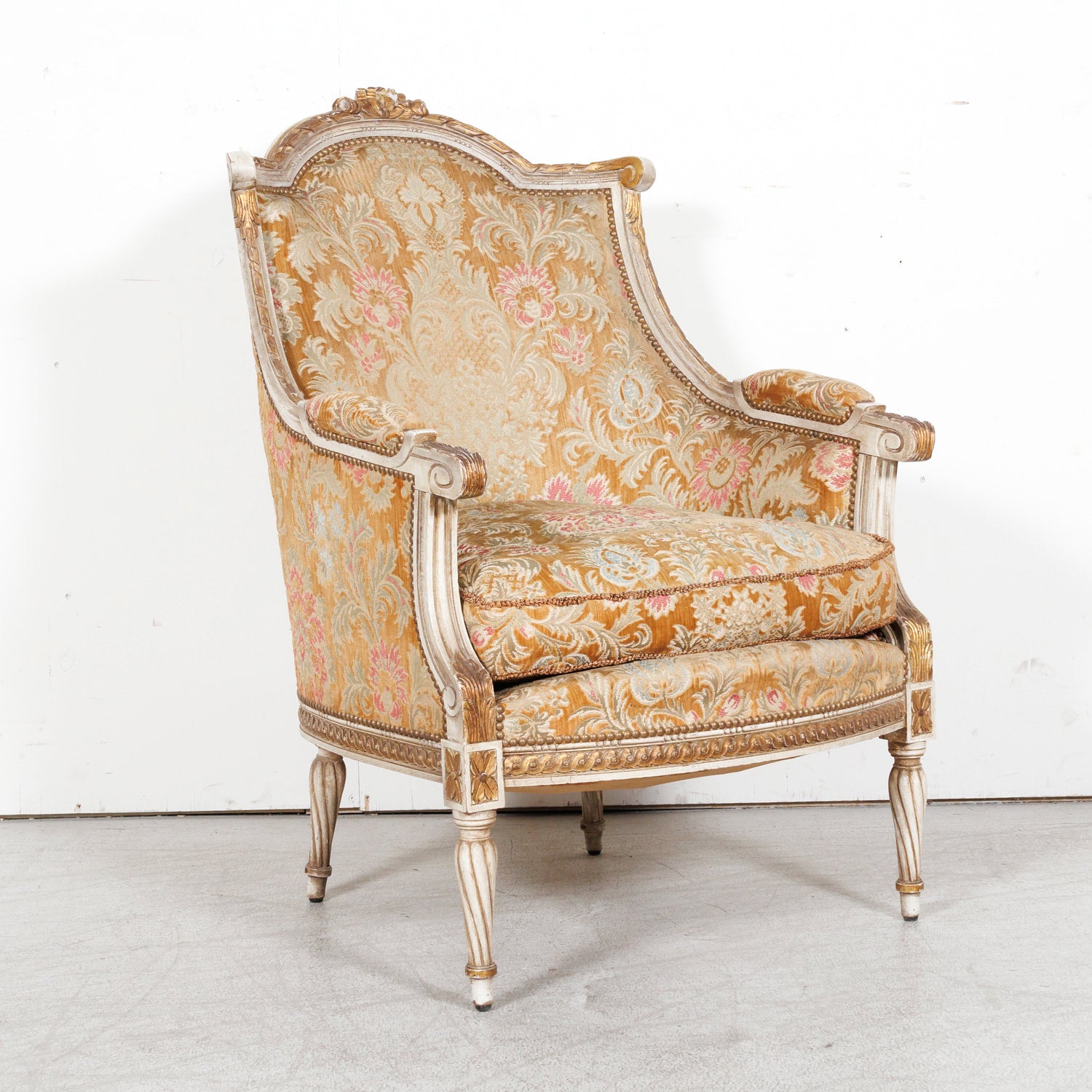 Pair of Early 21st Century French Louis XVI Style Parcel Gilt and Painted Maison Jansen Bergere Armchairs