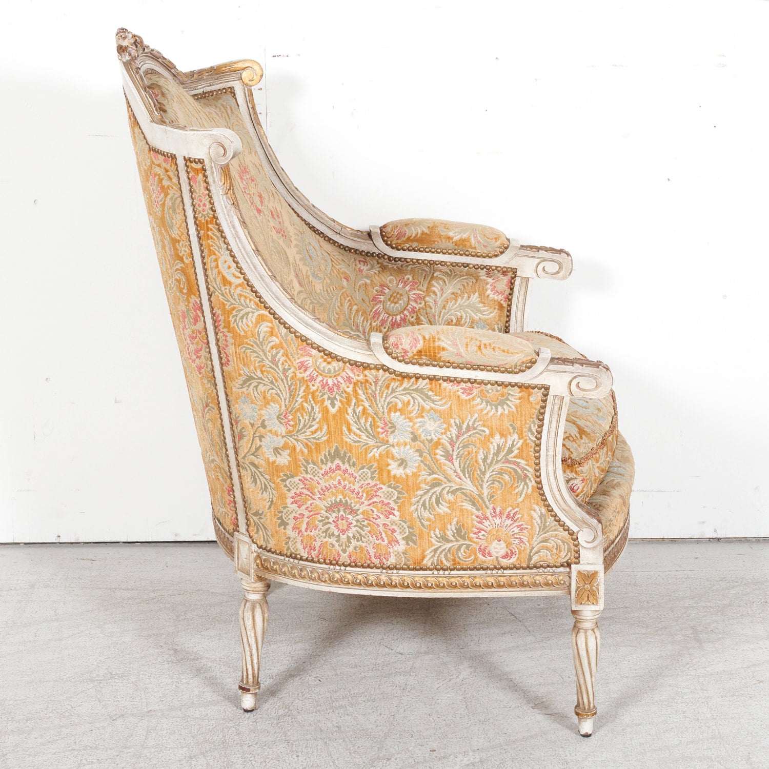 Pair of Early 21st Century French Louis XVI Style Parcel Gilt and Painted Maison Jansen Bergere Armchairs