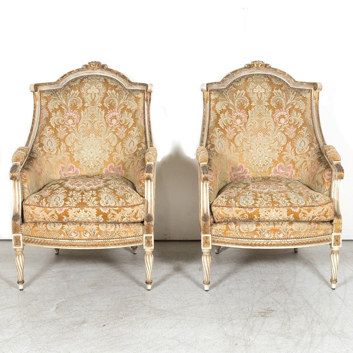 Pair of Early 21st Century French Louis XVI Style Parcel Gilt and Painted Maison Jansen Bergere Armchairs