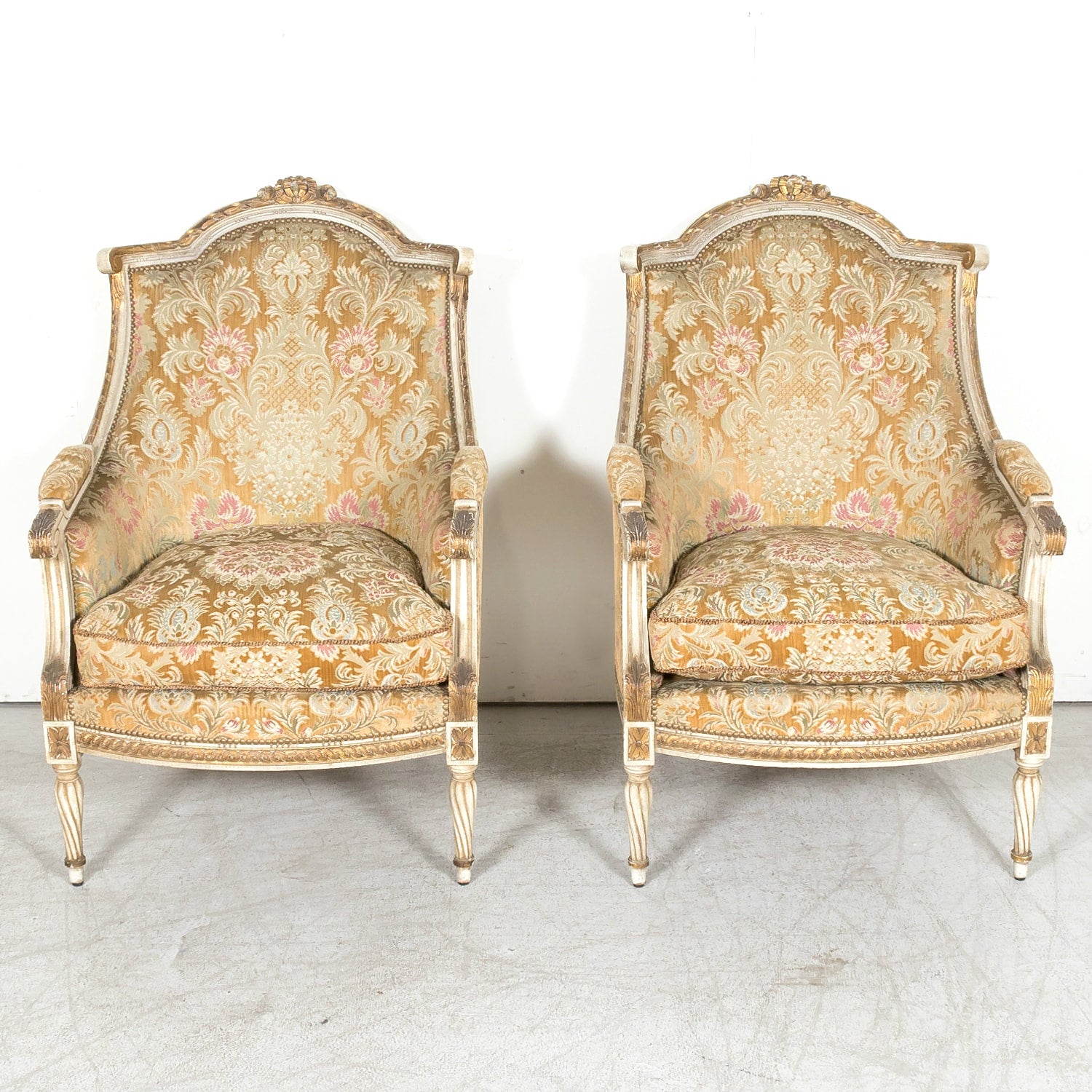 Pair of Early 21st Century French Louis XVI Style Parcel Gilt and Painted Maison Jansen Bergere Armchairs