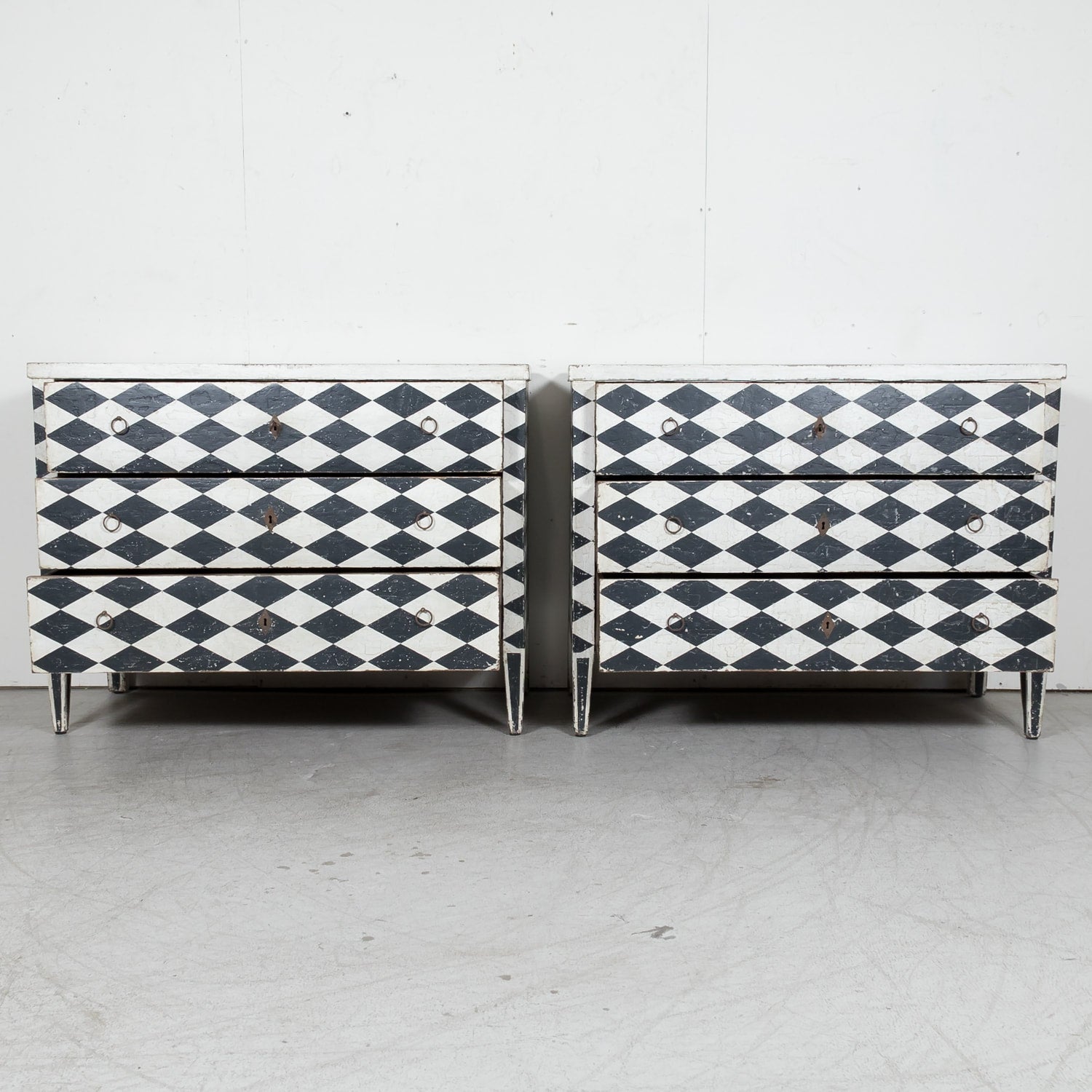 Pair of 19th Century French Louis XVI Style Black and White Harlequin Pattern Painted Commodes 