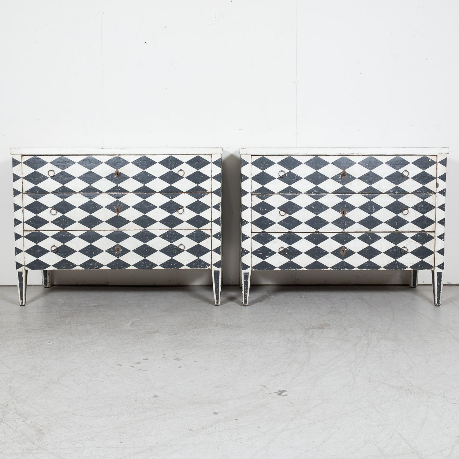 Pair of 19th Century French Louis XVI Style Black and White Harlequin Pattern Painted Commodes 