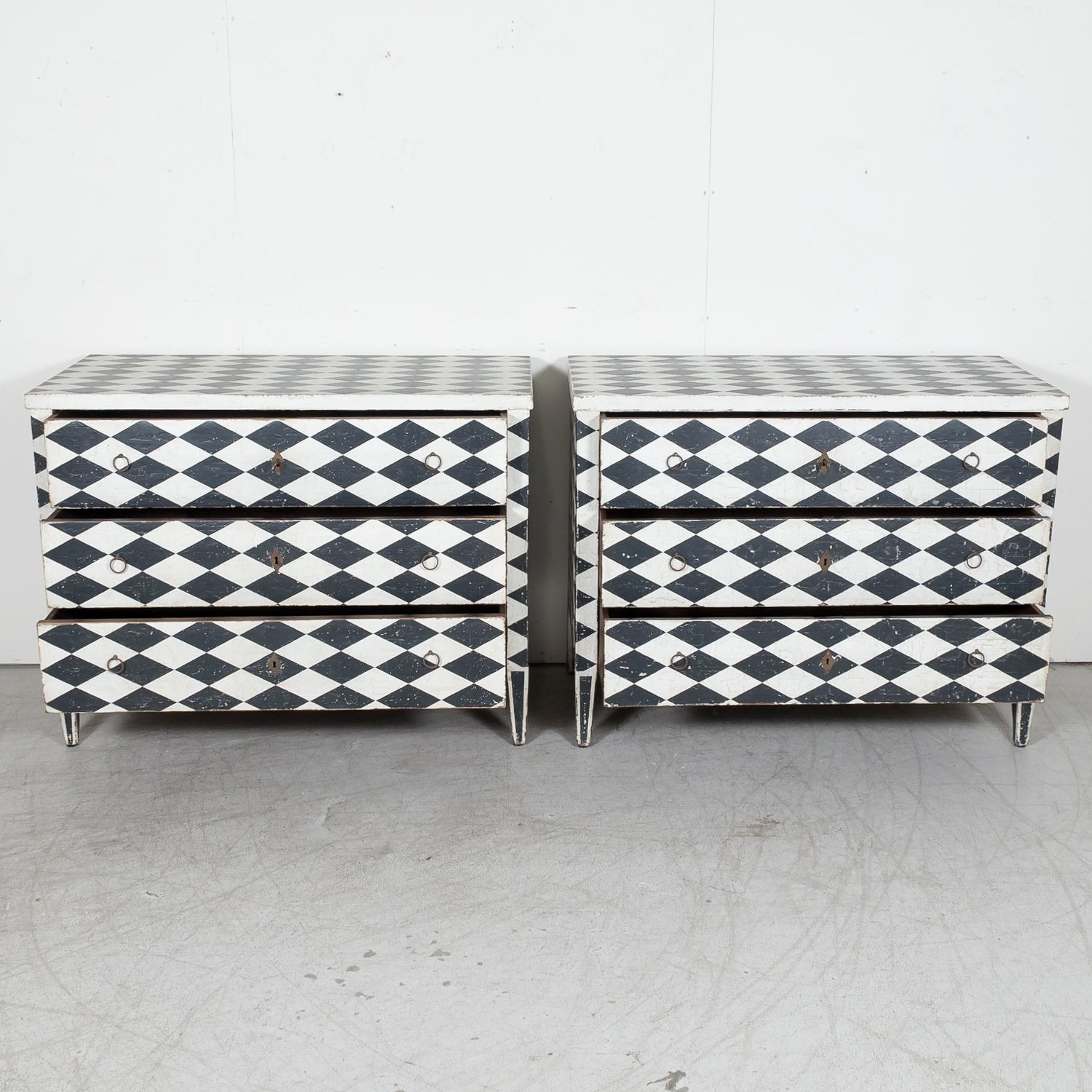 Pair of 19th Century French Louis XVI Style Black and White Harlequin Pattern Painted Commodes 