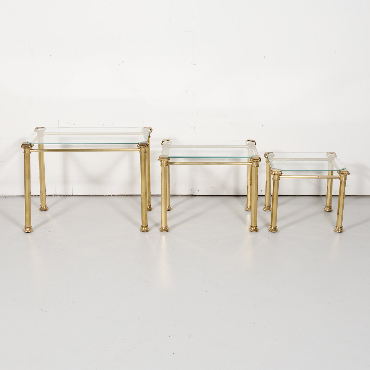 Set of Three French Mid-Century Modern Brass and Glass Nesting Tables by Maison Baguès