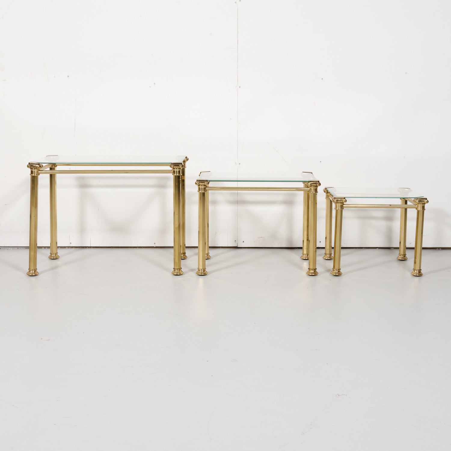 Set of Three French Mid-Century Modern Brass and Glass Nesting Tables by Maison Baguès