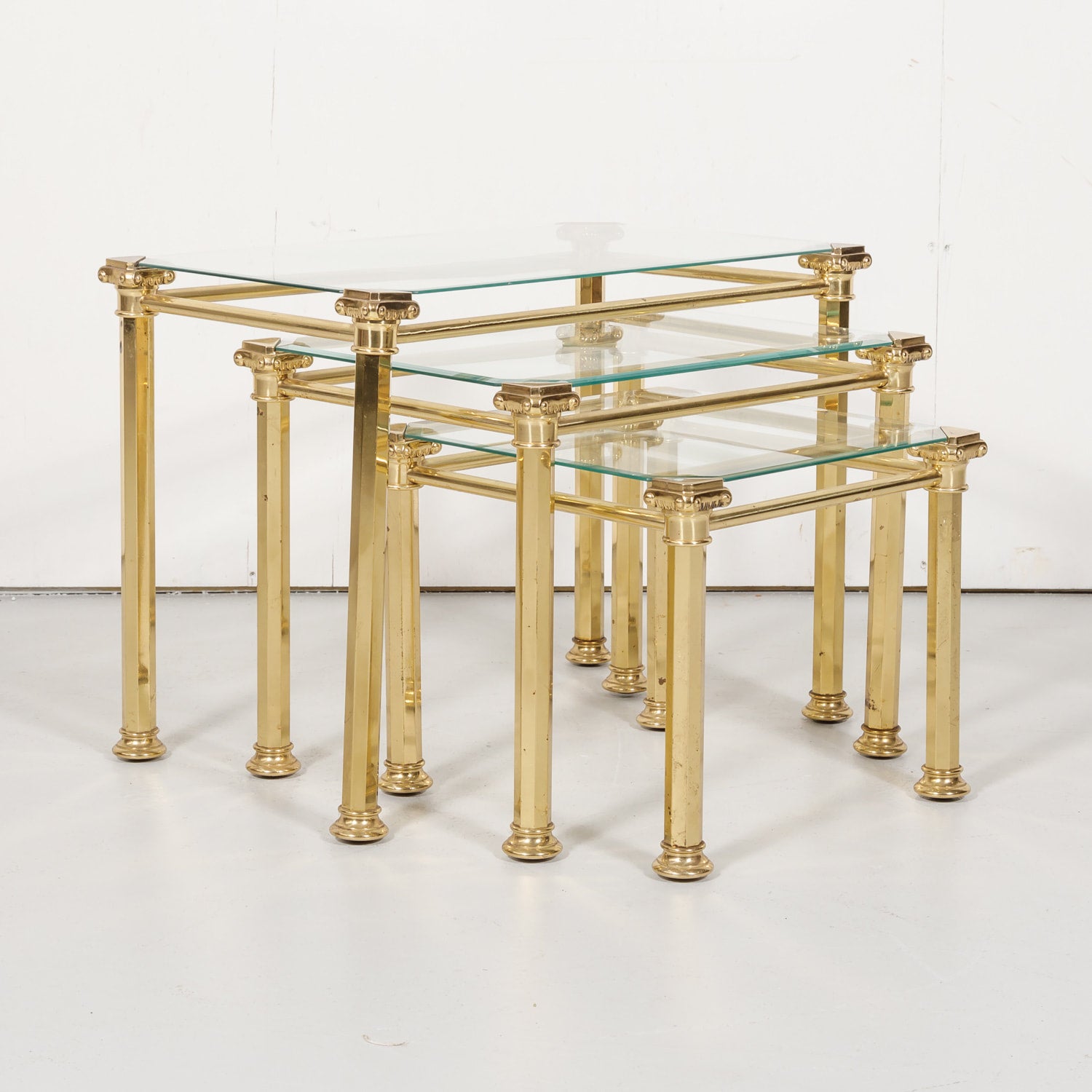 Set of Three French Mid-Century Modern Brass and Glass Nesting Tables by Maison Baguès