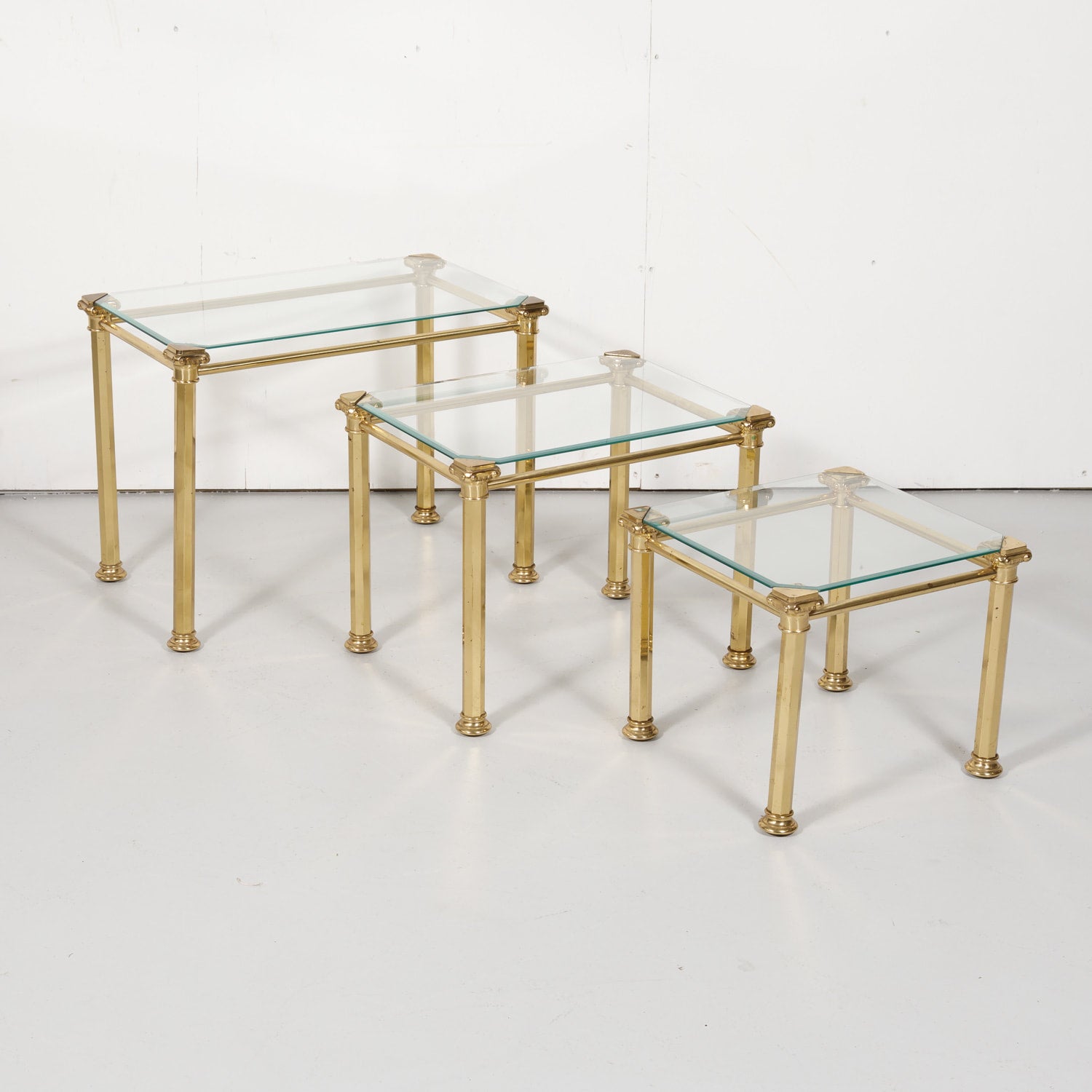 Set of Three French Mid-Century Modern Brass and Glass Nesting Tables by Maison Baguès