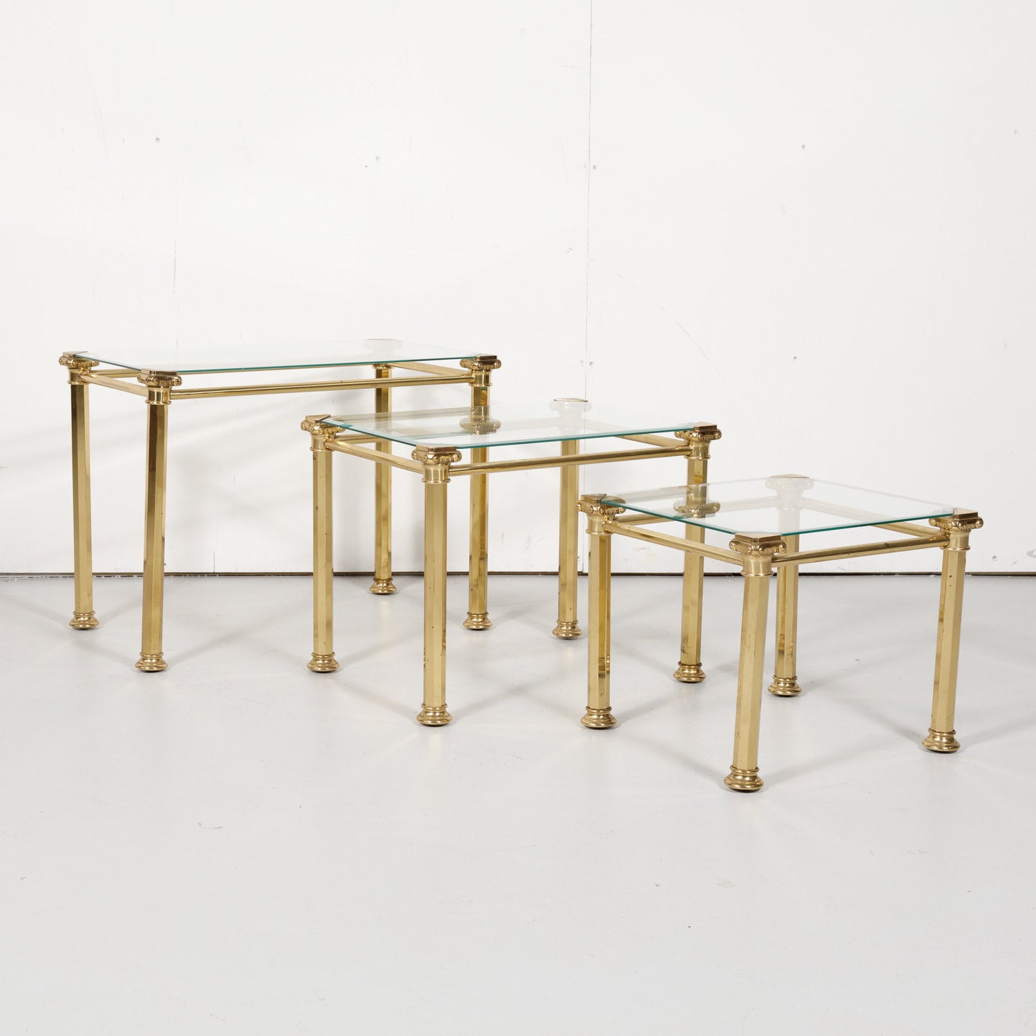 Set of Three French Mid-Century Modern Brass and Glass Nesting Tables by Maison Baguès