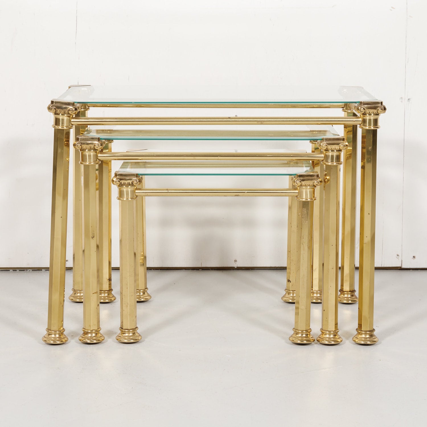 Set of Three French Mid-Century Modern Brass and Glass Nesting Tables by Maison Baguès