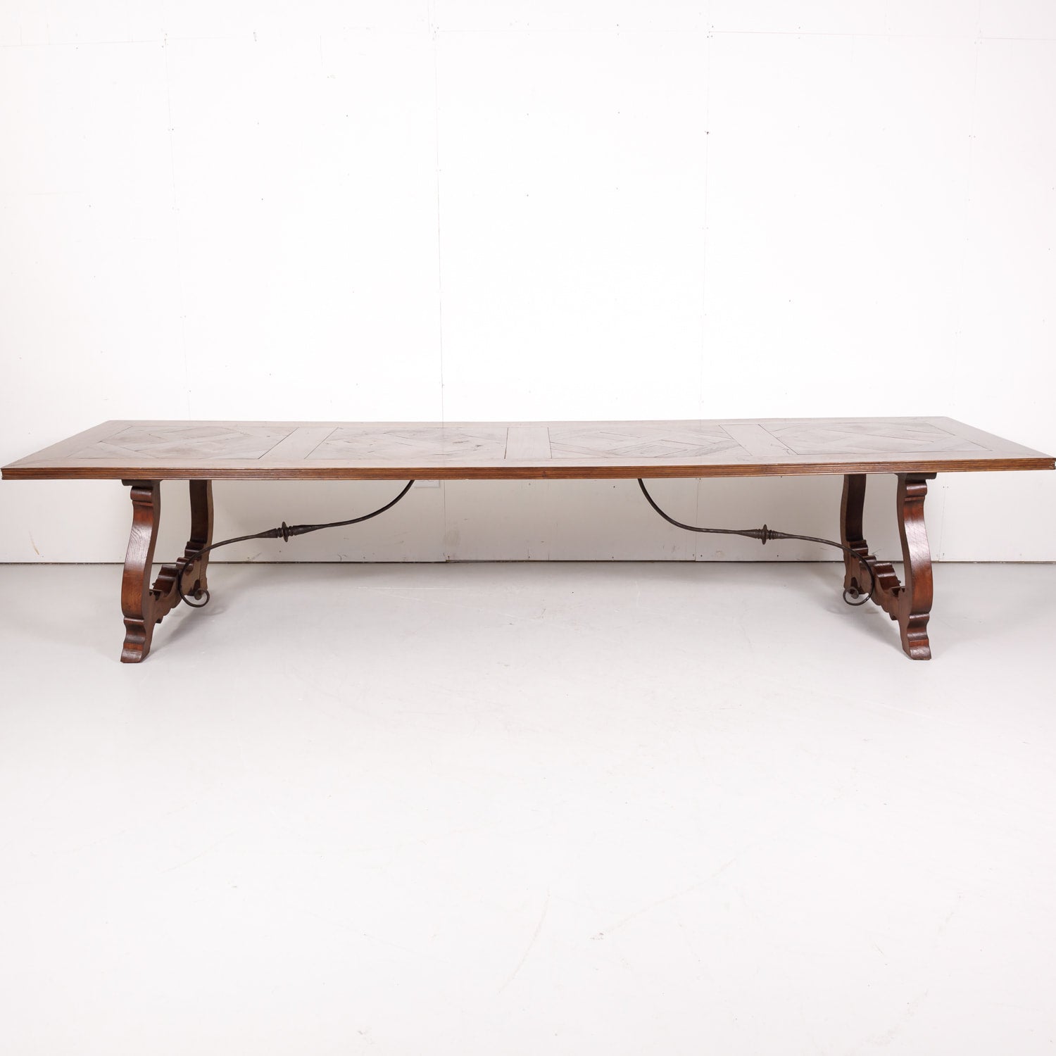 Impressive Antique French Walnut Trestle Table with Parquet de Versailles Top and Iron Stretcher