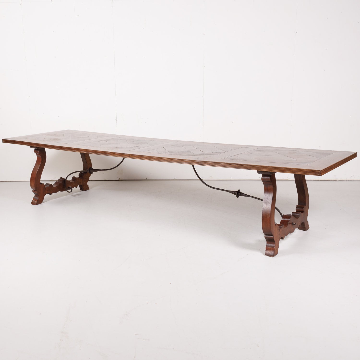 Impressive Antique French Walnut Trestle Table with Parquet de Versailles Top and Iron Stretcher