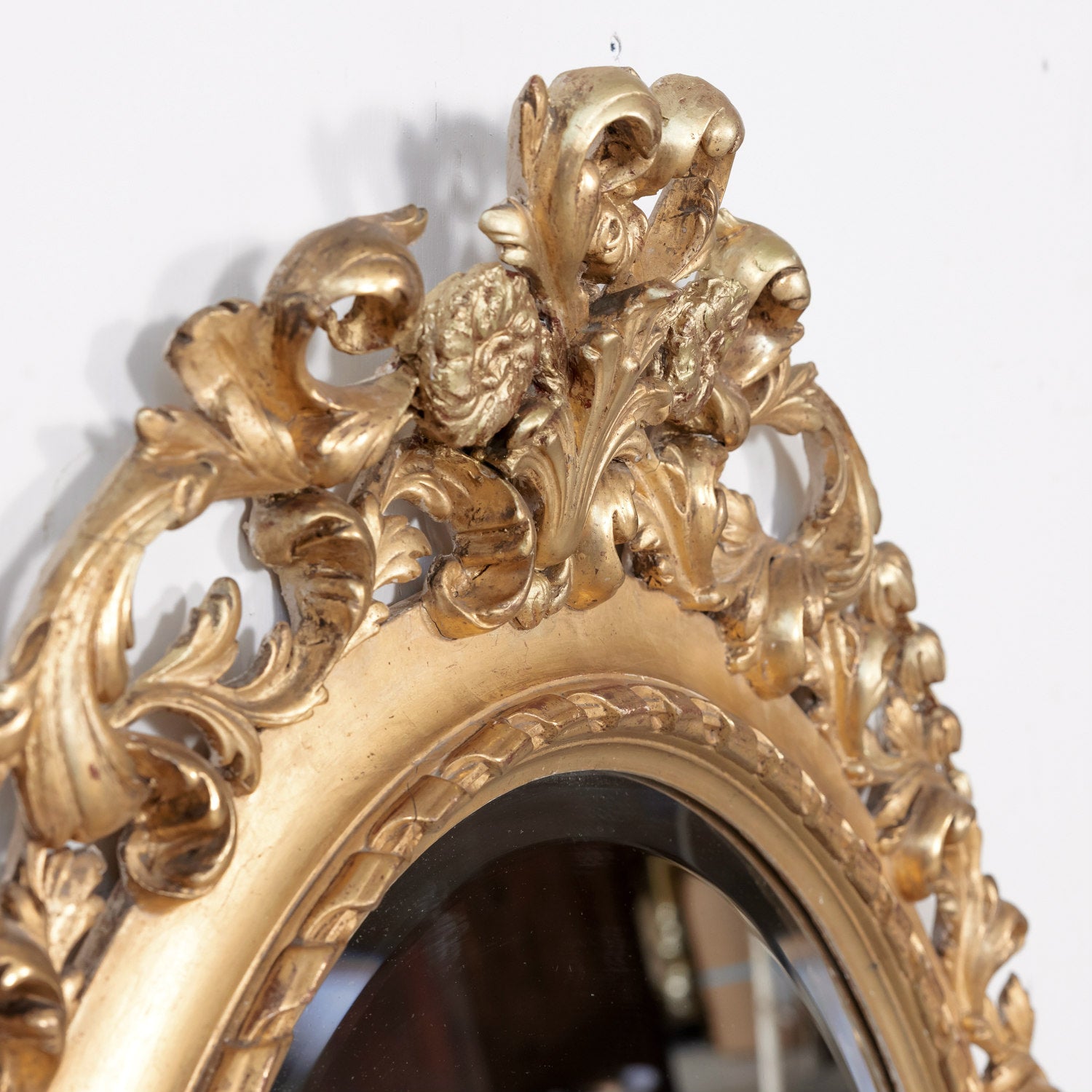 19th Century Carved French Louis XVI Style Oval Shaped Giltwood Mirror with Beveled Glass