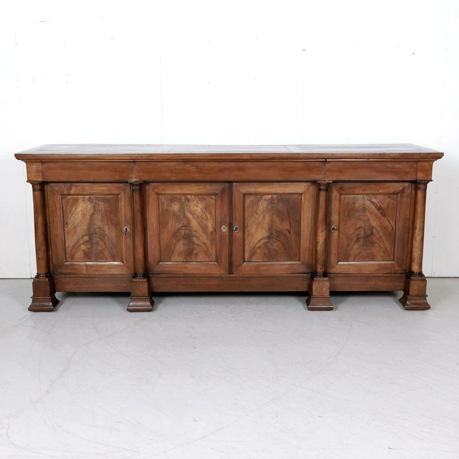 Exceptional Early 19th Century French Empire Period Chateau Enfilade in Walnut with Bookmatched Doors