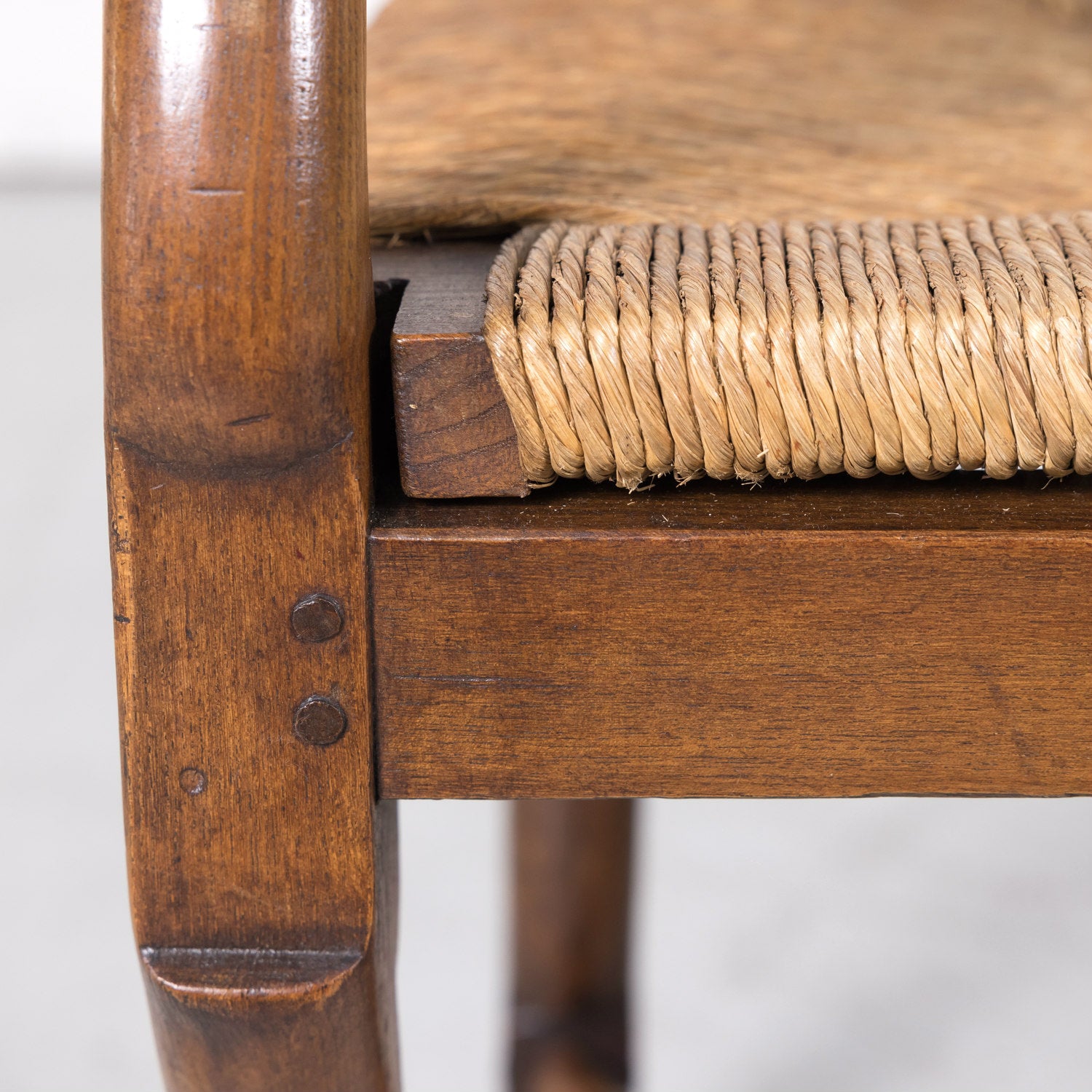 Pair of Antique Country French Louis XIV Style Oak Ladder Back Arm Chairs with Rush Seats