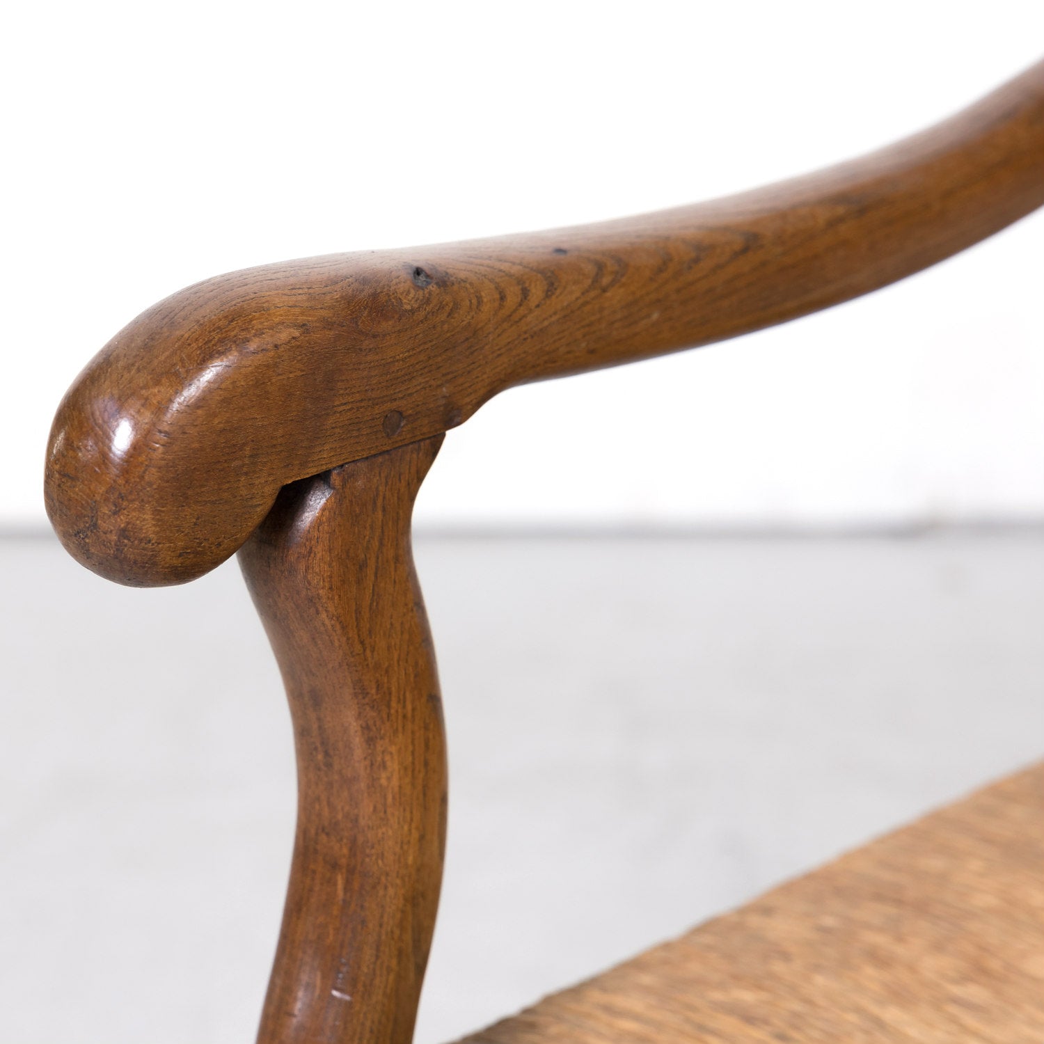 Pair of Antique Country French Louis XIV Style Oak Ladder Back Arm Chairs with Rush Seats