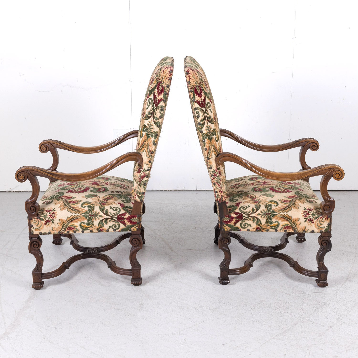 Pair of 19th Century French Louis XIV Style Carved Walnut Fauteuils