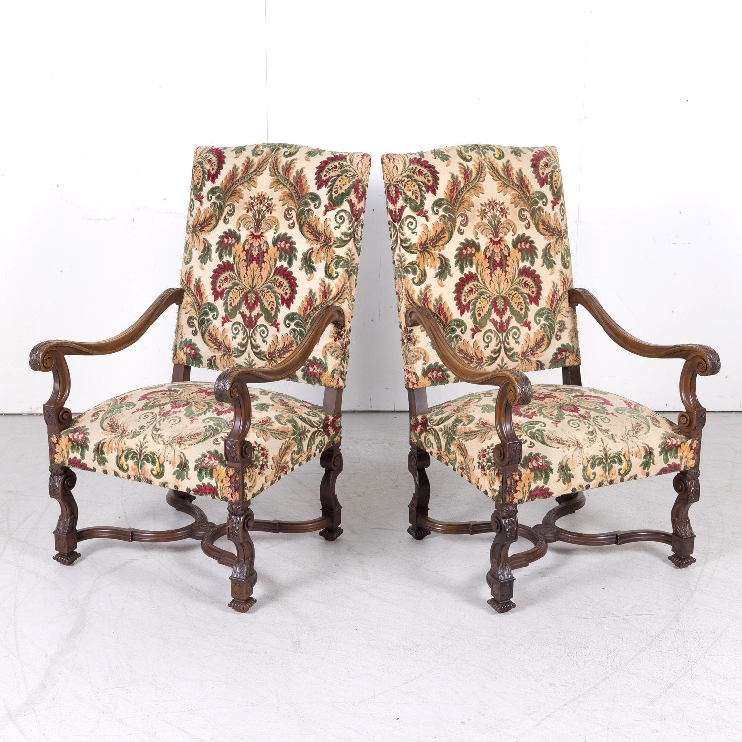 Pair of 19th Century French Louis XIV Style Carved Walnut Fauteuils