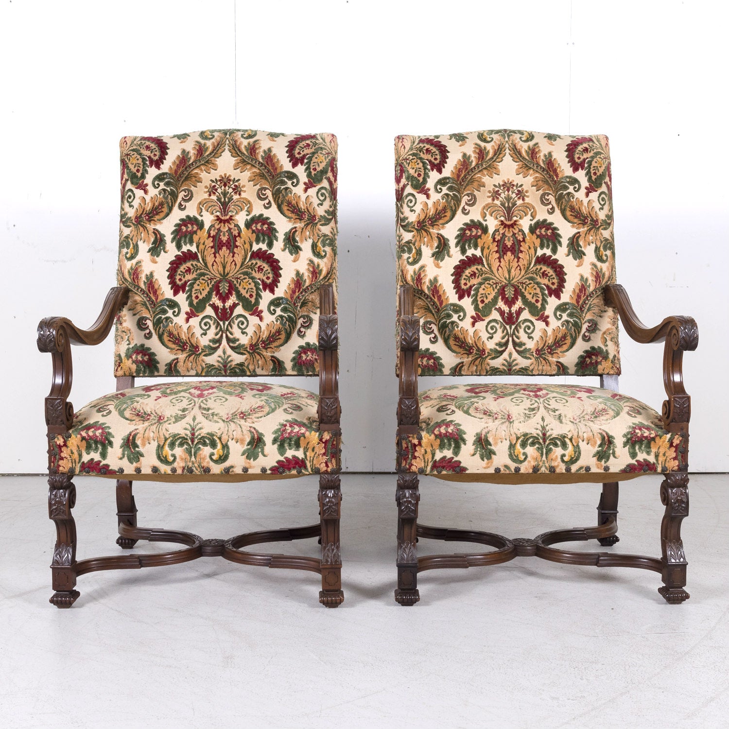 Pair of 19th Century French Louis XIV Style Carved Walnut Fauteuils