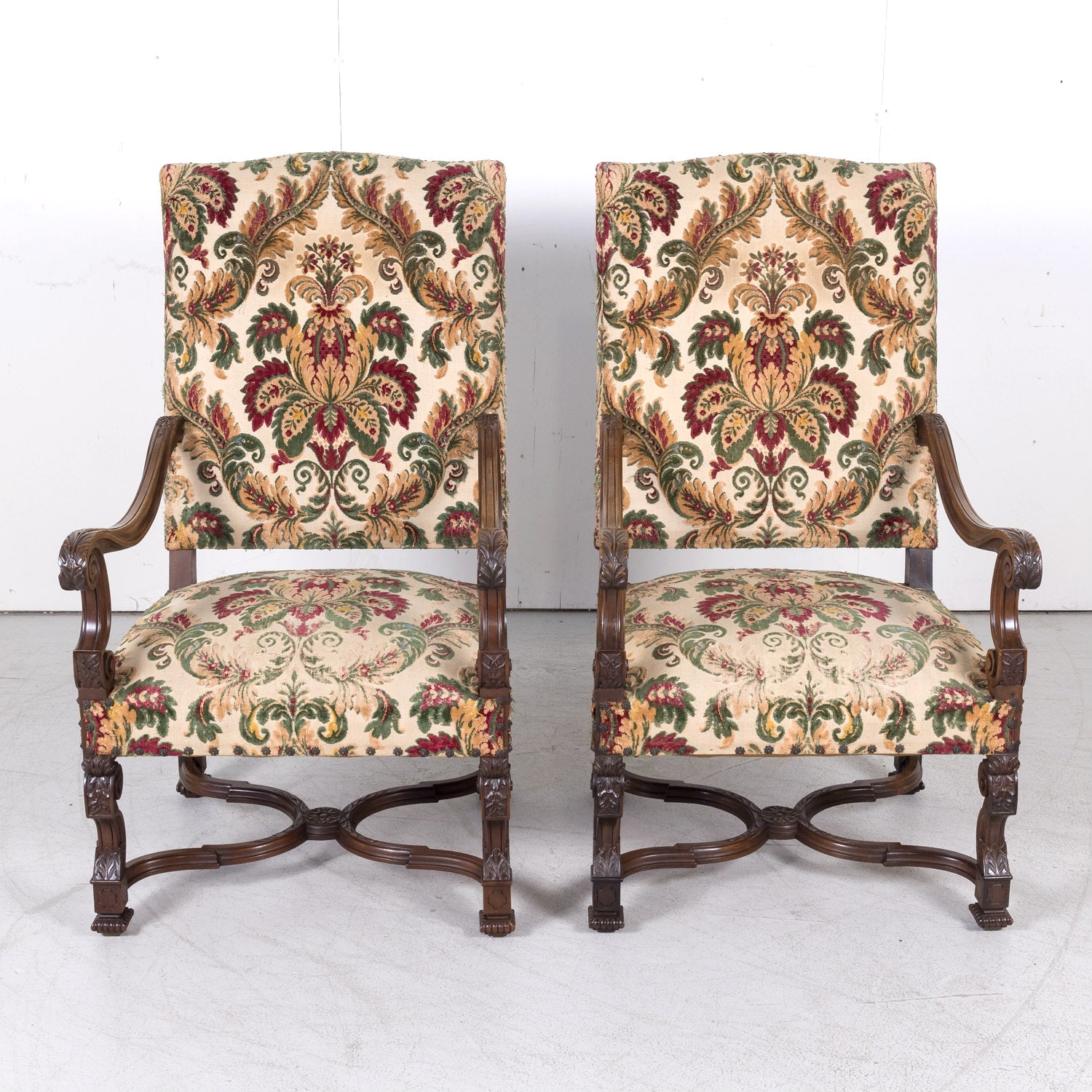 Pair of 19th Century French Louis XIV Style Carved Walnut Fauteuils