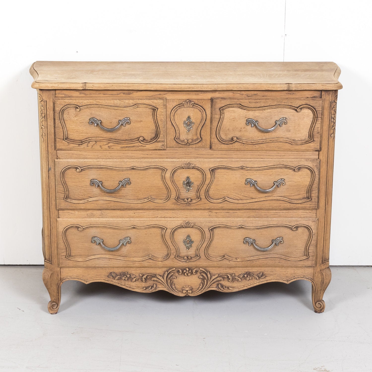 Antique French Country Louis XV Style Carved Bleached Oak Four-Drawer Commode