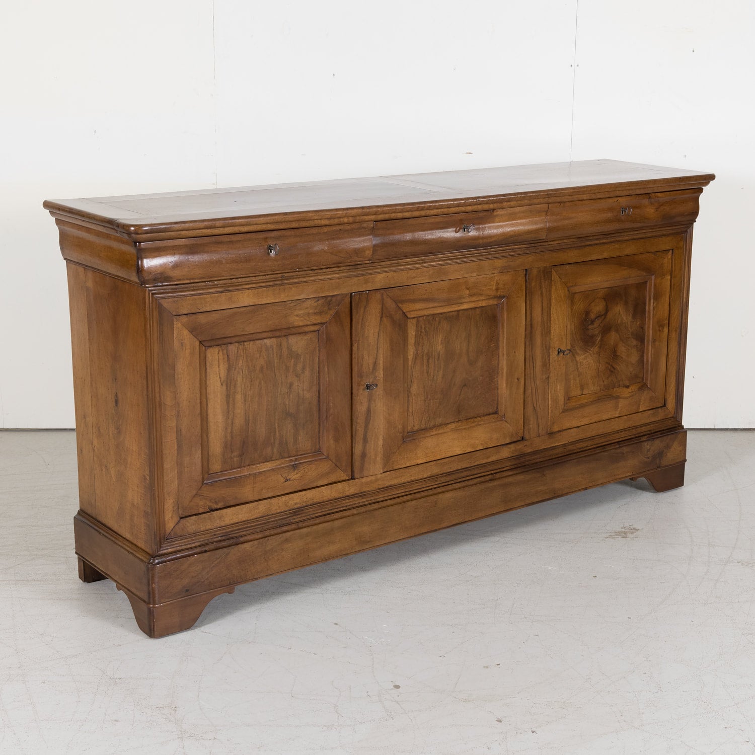 Louis Philippe Enfilade Buffet made of Walnut with Doucine Drawers from Bordeaux France Circa Early 1800s