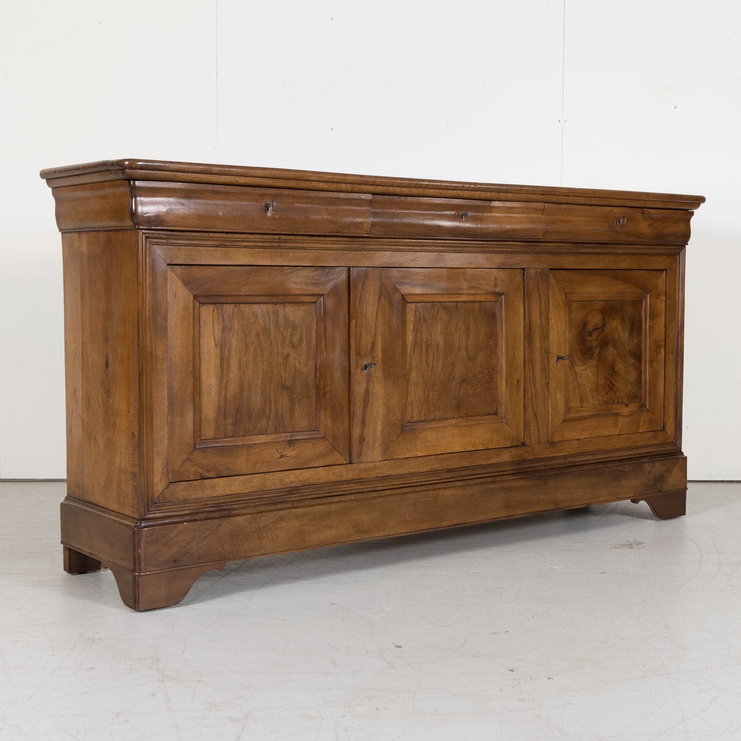 Louis Philippe Enfilade Buffet made of Walnut with Doucine Drawers from Bordeaux France Circa Early 1800s