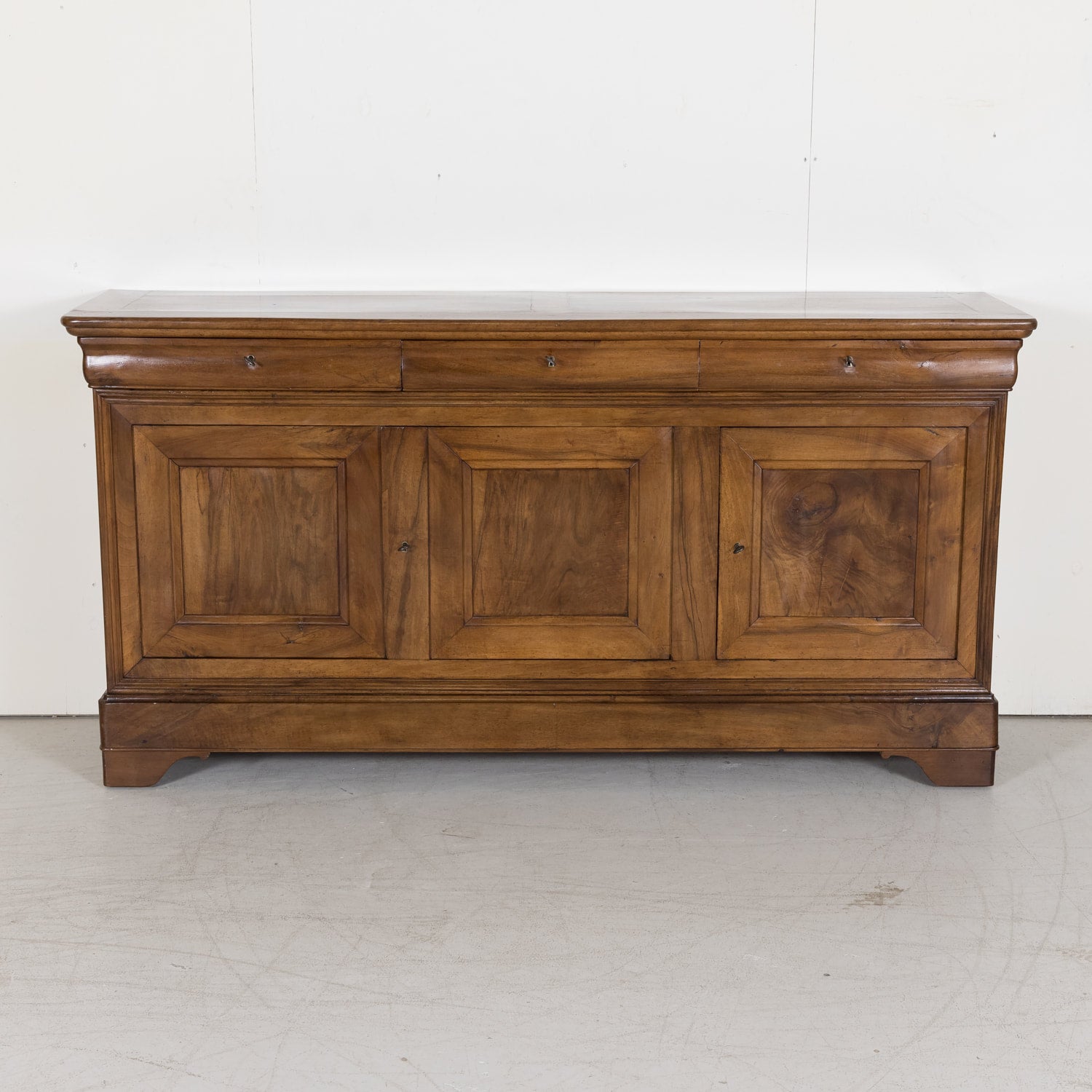 Louis Philippe Enfilade Buffet made of Walnut with Doucine Drawers from Bordeaux France Circa Early 1800s