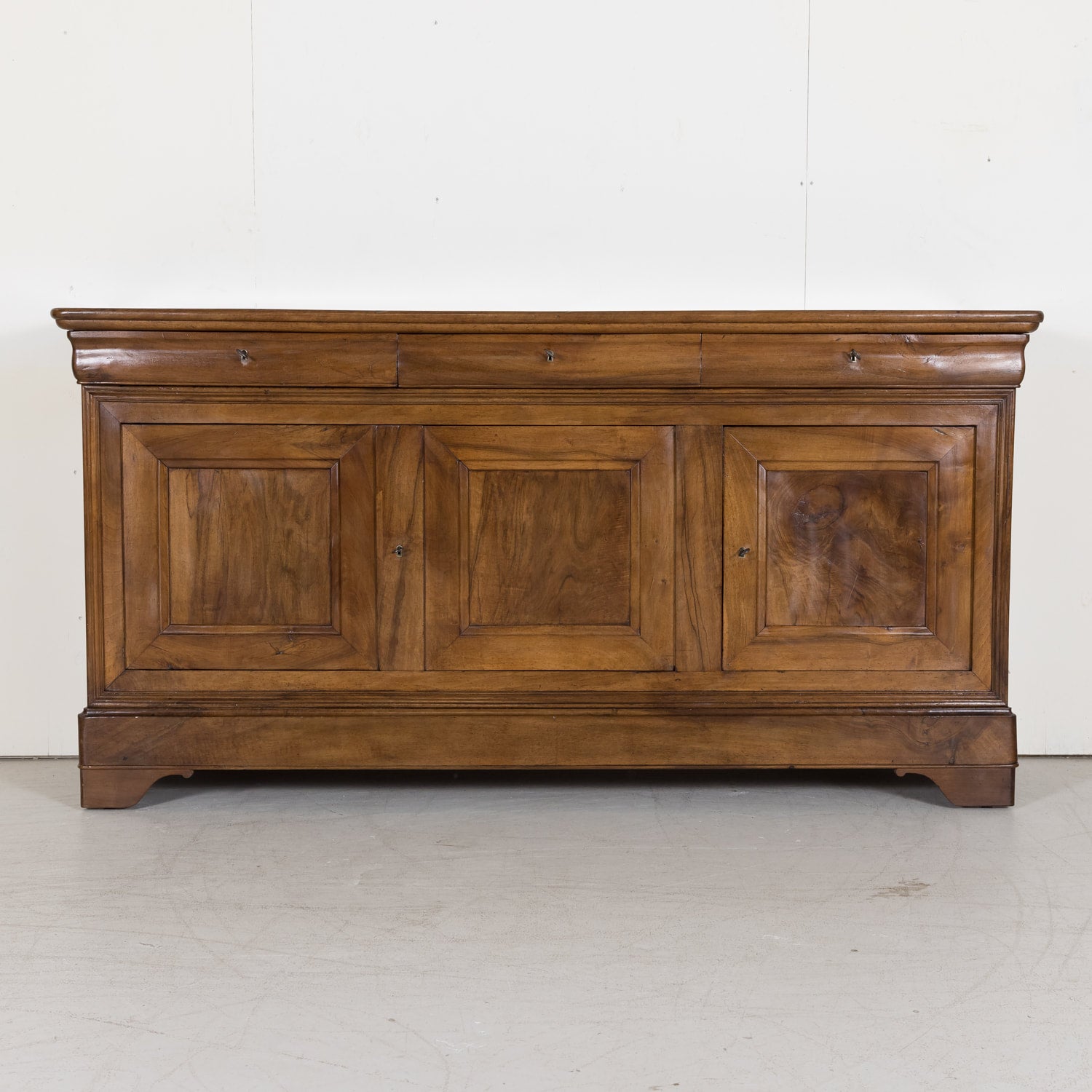 Louis Philippe Enfilade Buffet made of Walnut with Doucine Drawers from Bordeaux France Circa Early 1800s