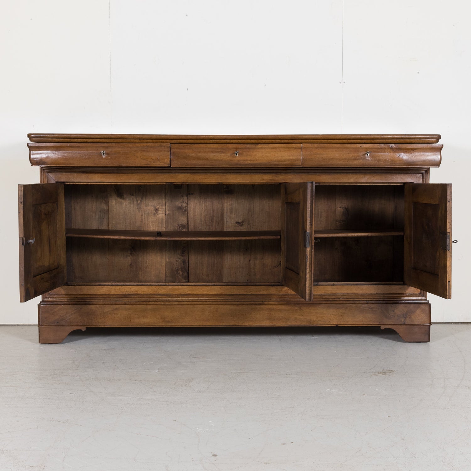 Louis Philippe Enfilade Buffet made of Walnut with Doucine Drawers from Bordeaux France Circa Early 1800s