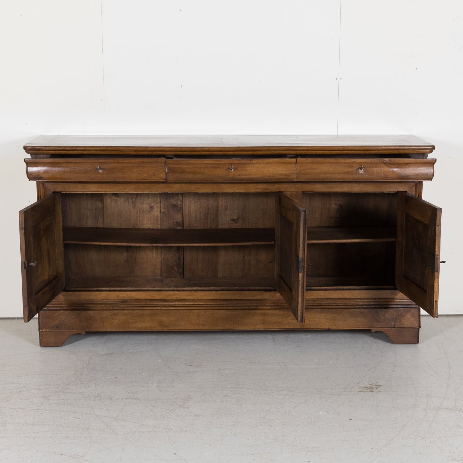 Louis Philippe Enfilade Buffet made of Walnut with Doucine Drawers from Bordeaux France Circa Early 1800s