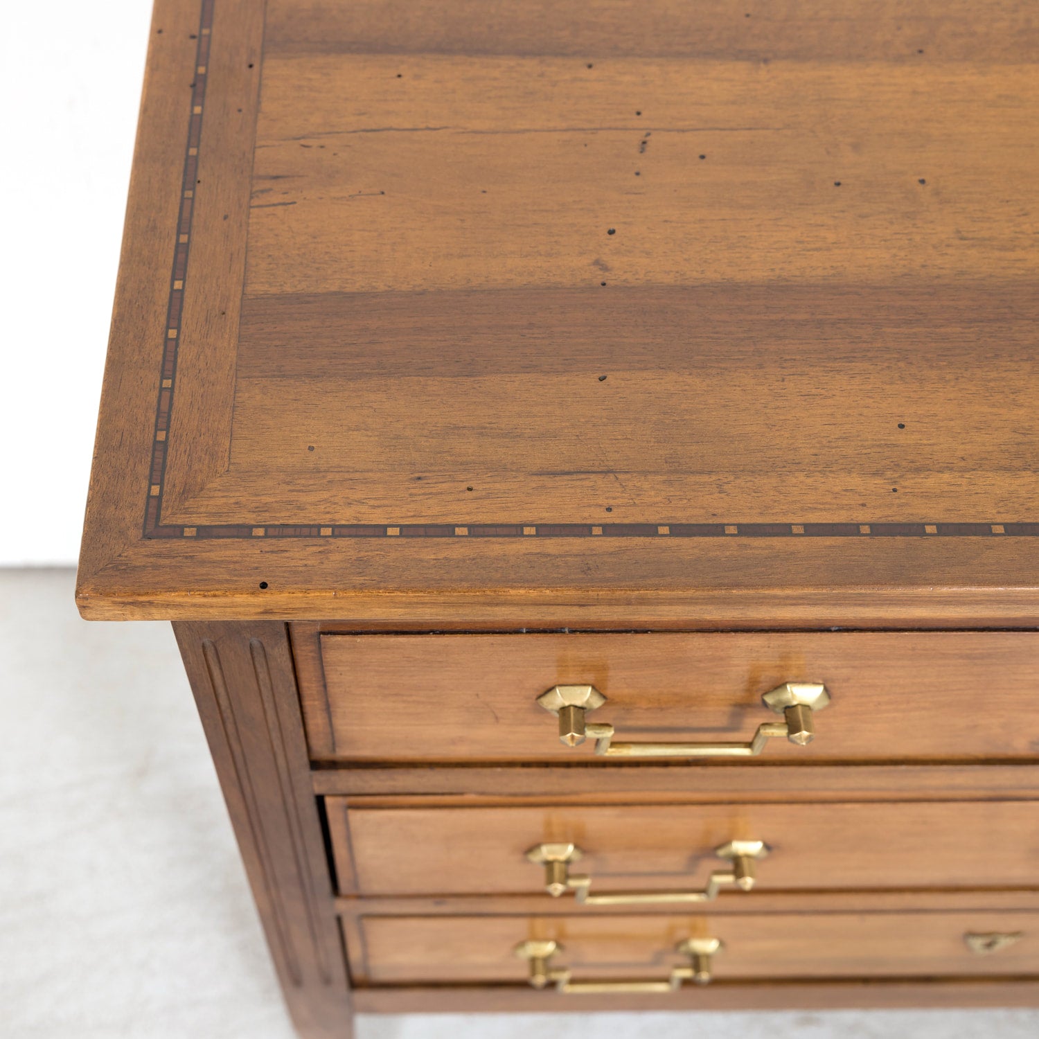 Late 19th Century French Louis XVI Style Petite Walnut Commode with Marquetry Band on Top