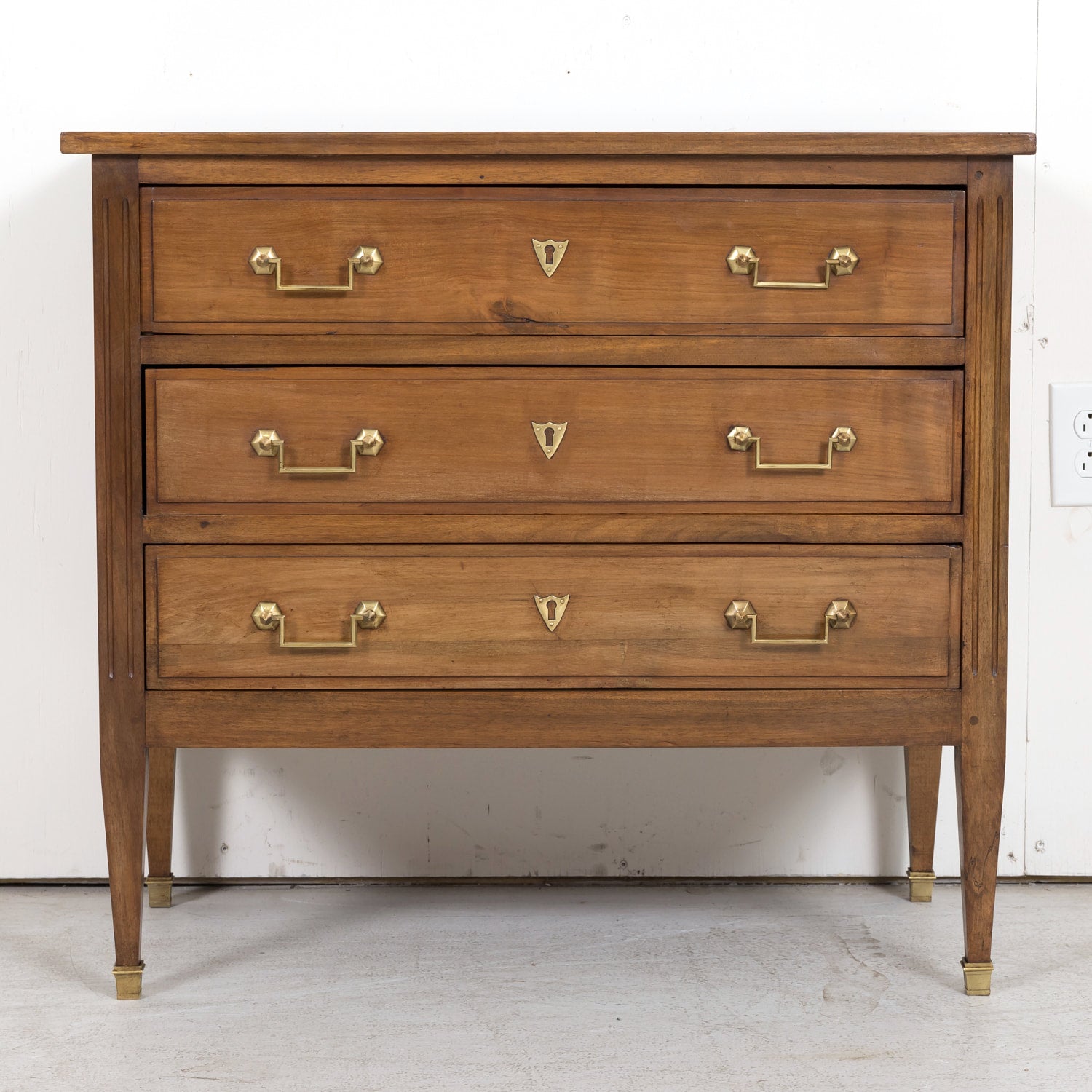 Late 19th Century French Louis XVI Style Petite Walnut Commode with Marquetry Band on Top