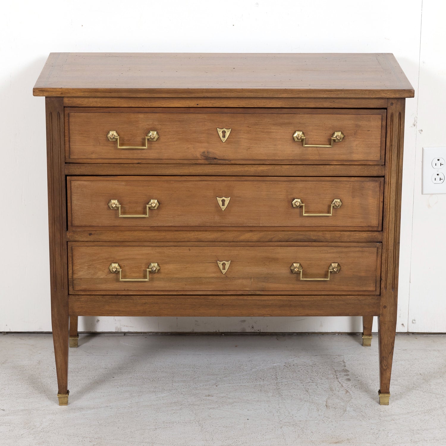 Late 19th Century French Louis XVI Style Petite Walnut Commode with Marquetry Band on Top