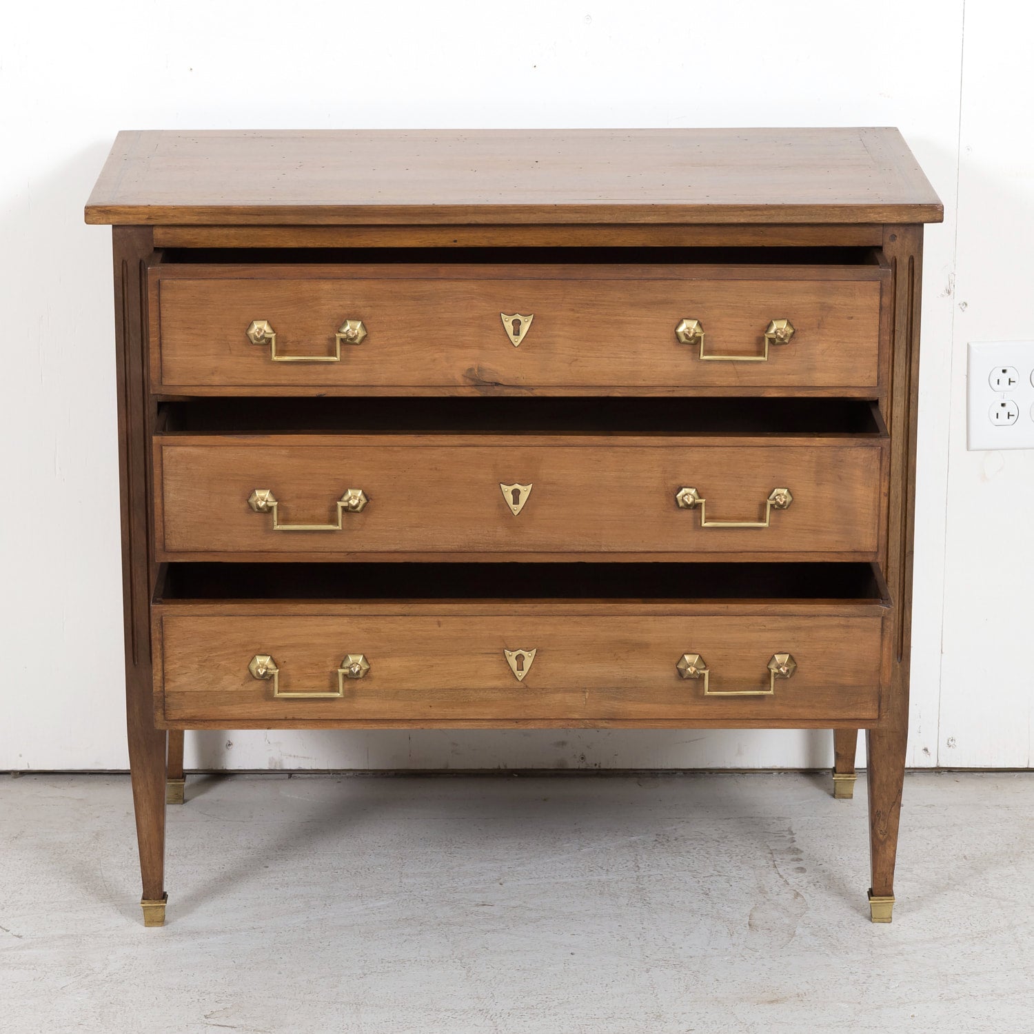 Late 19th Century French Louis XVI Style Petite Walnut Commode with Marquetry Band on Top