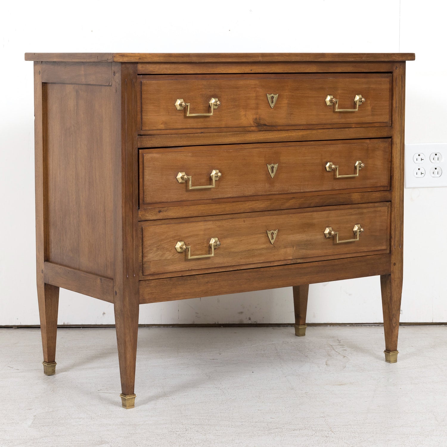 Late 19th Century French Louis XVI Style Petite Walnut Commode with Marquetry Band on Top