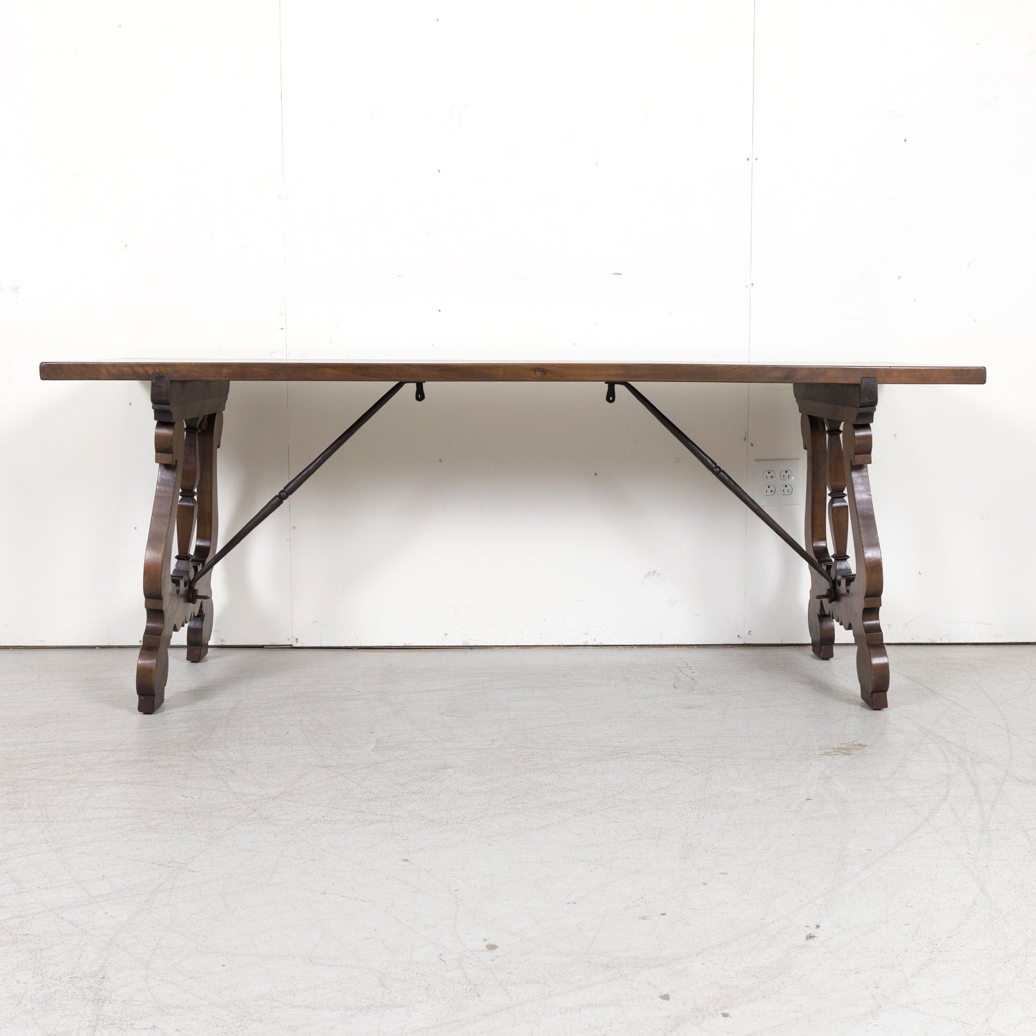 19th Century Spanish Baroque Style Walnut Trestle Dining Table with Iron Stretchers
