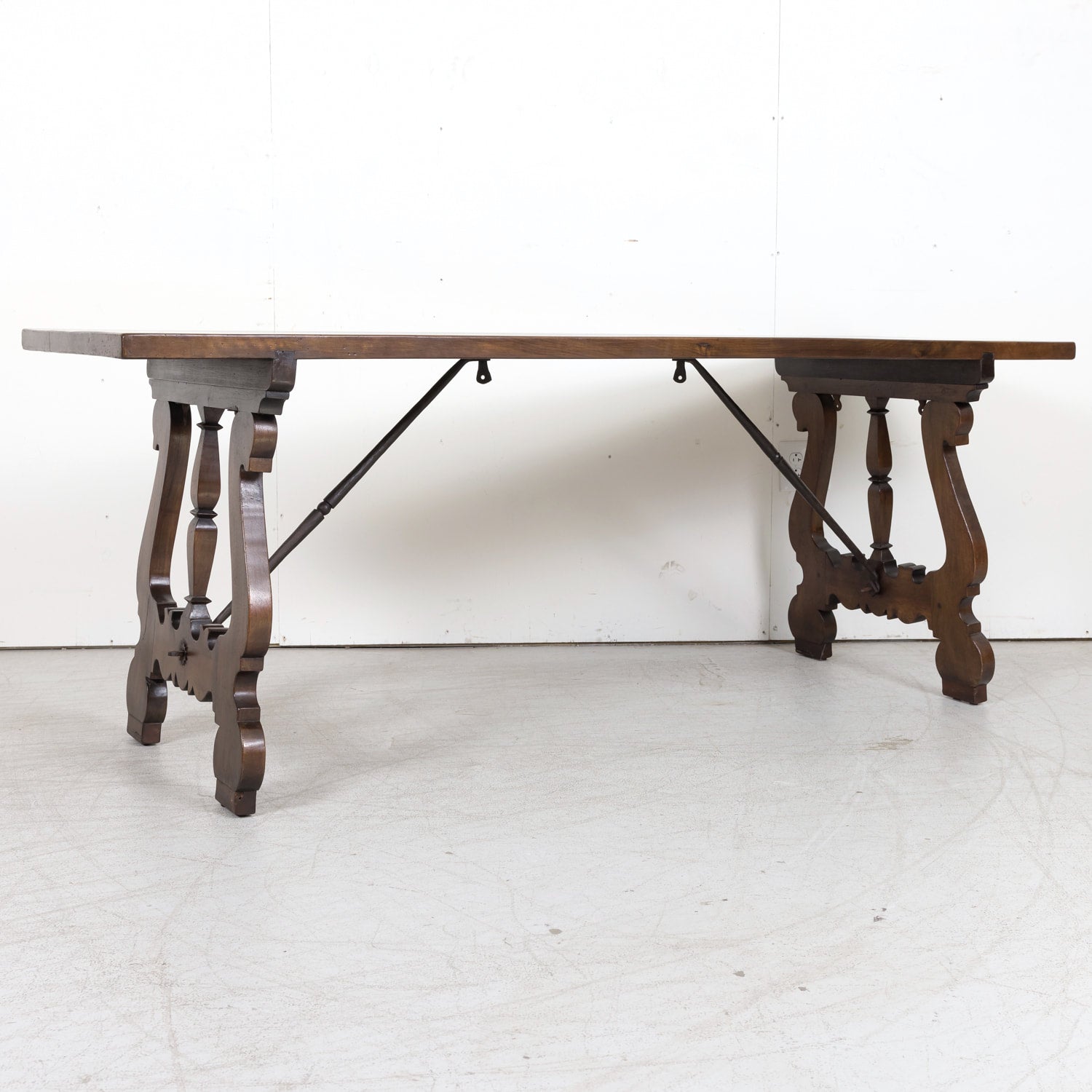 19th Century Spanish Baroque Style Walnut Trestle Dining Table with Iron Stretchers
