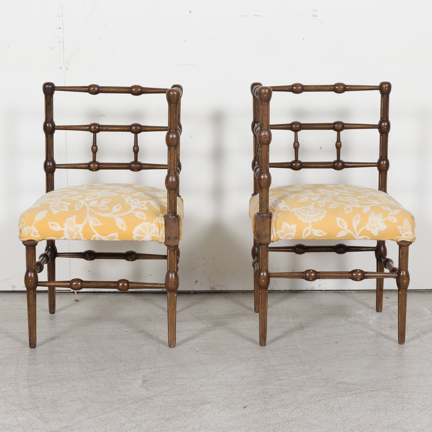 Pair of faux bamboo corner chairs from Normandie