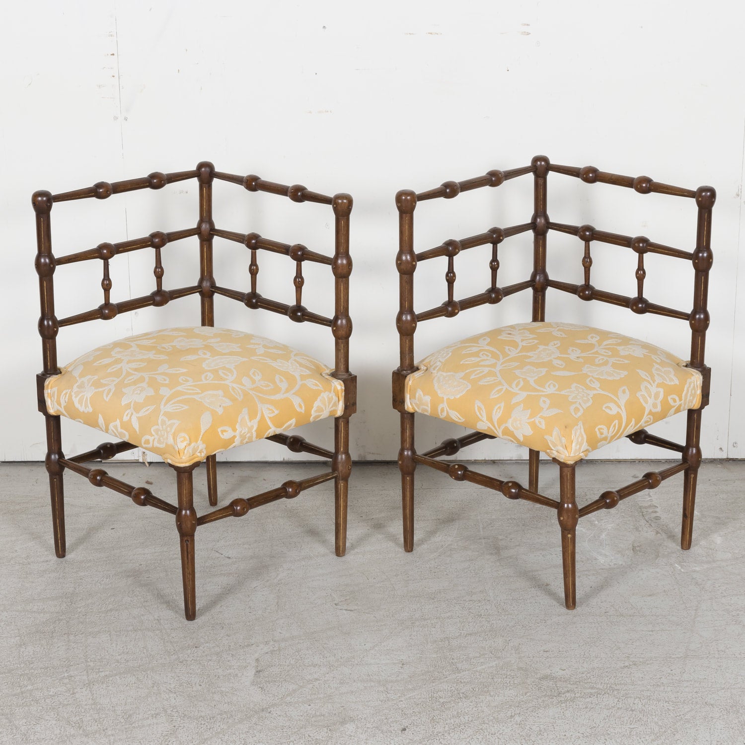 Pair of faux bamboo corner chairs from Normandie