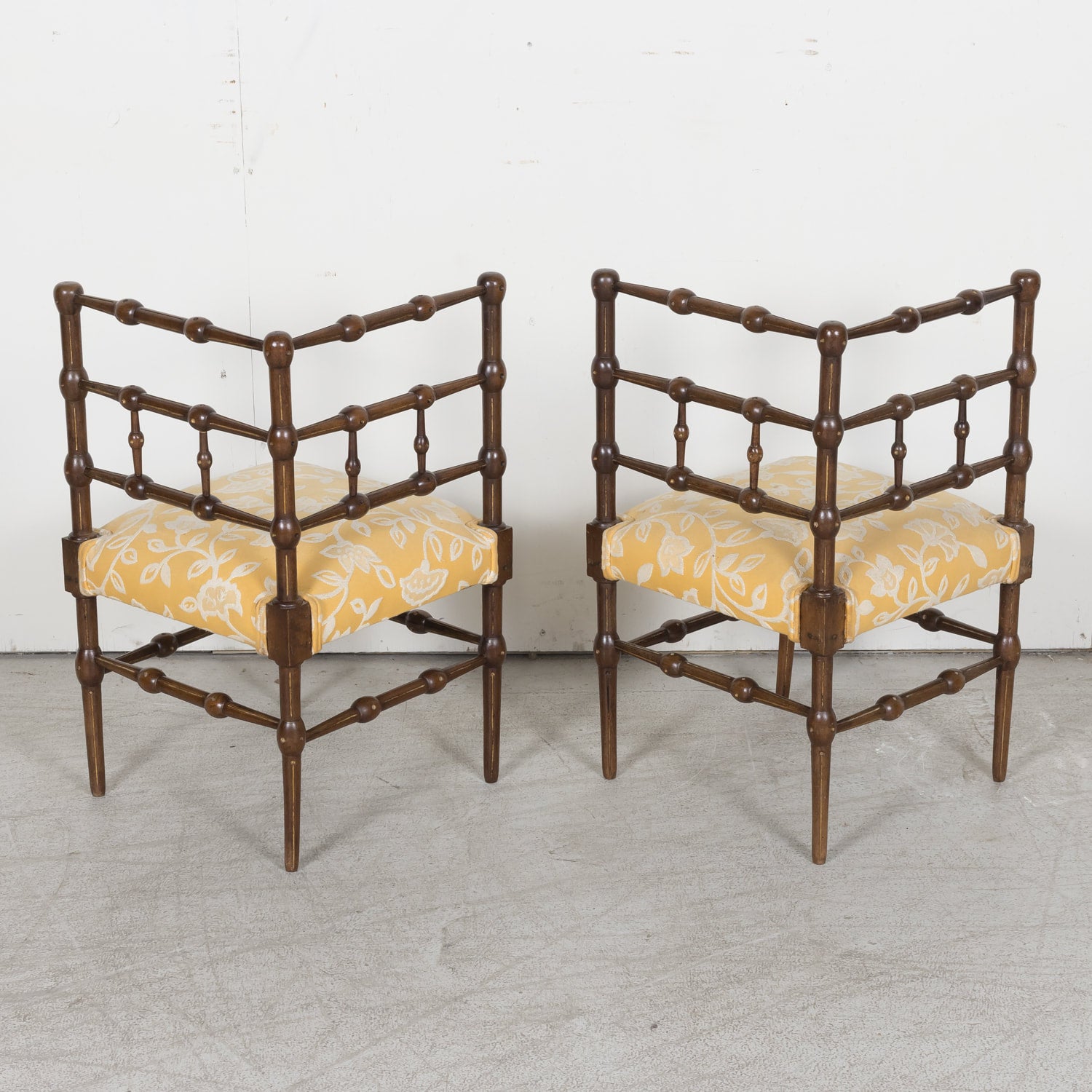 Pair of faux bamboo corner chairs from Normandie