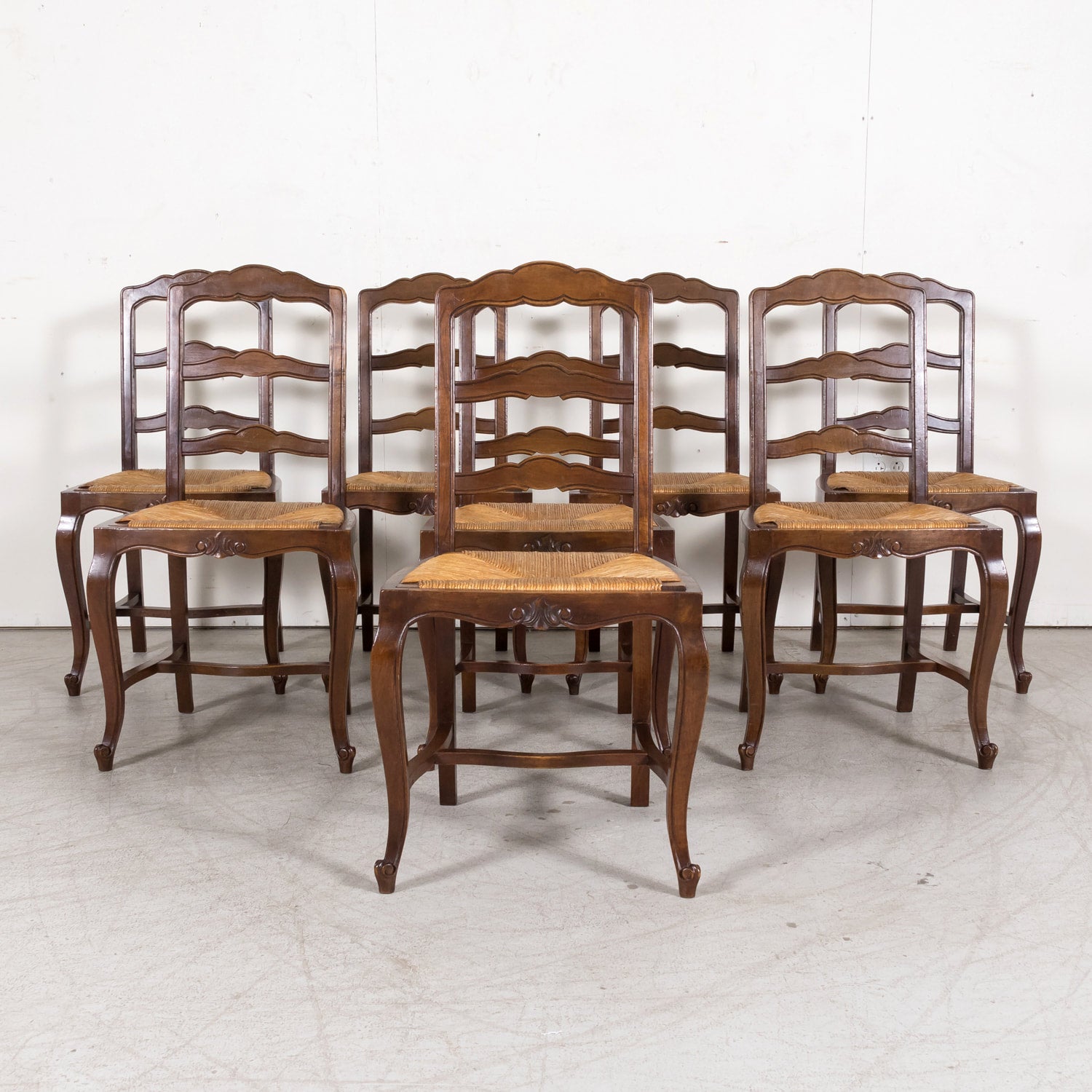 19th Century Country French Louis XV Style Walnut Ladder Back Dining Chairs with Rush Seats, Set of Eight