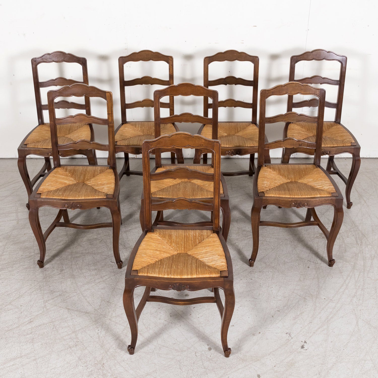 19th Century Country French Louis XV Style Walnut Ladder Back Dining Chairs with Rush Seats, Set of Eight