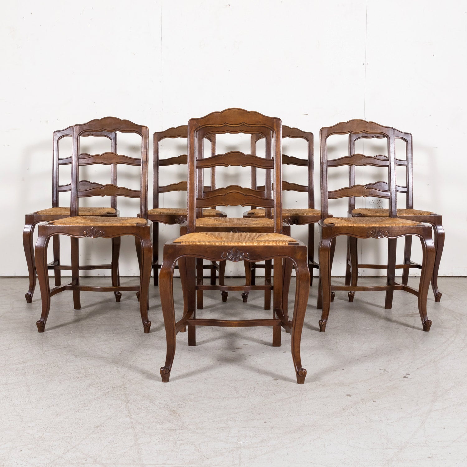 19th Century Country French Louis XV Style Walnut Ladder Back Dining Chairs with Rush Seats, Set of Eight