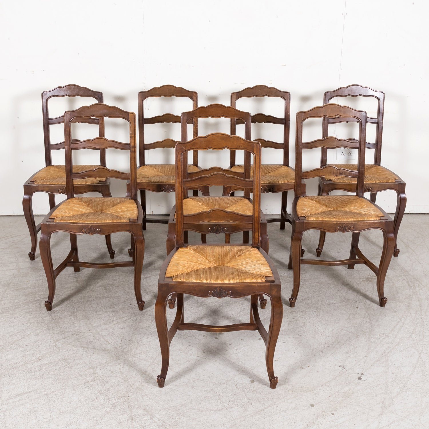 19th Century Country French Louis XV Style Walnut Ladder Back Dining Chairs with Rush Seats, Set of Eight